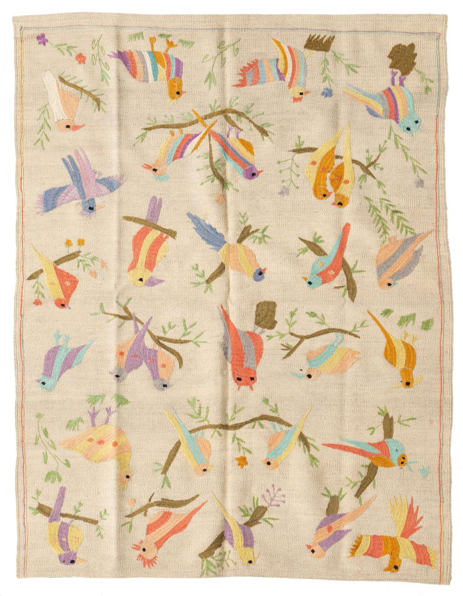 A 4x6 ivory flatweave wool rug with a colorful tribal bird and branch pattern, suitable for a living room.