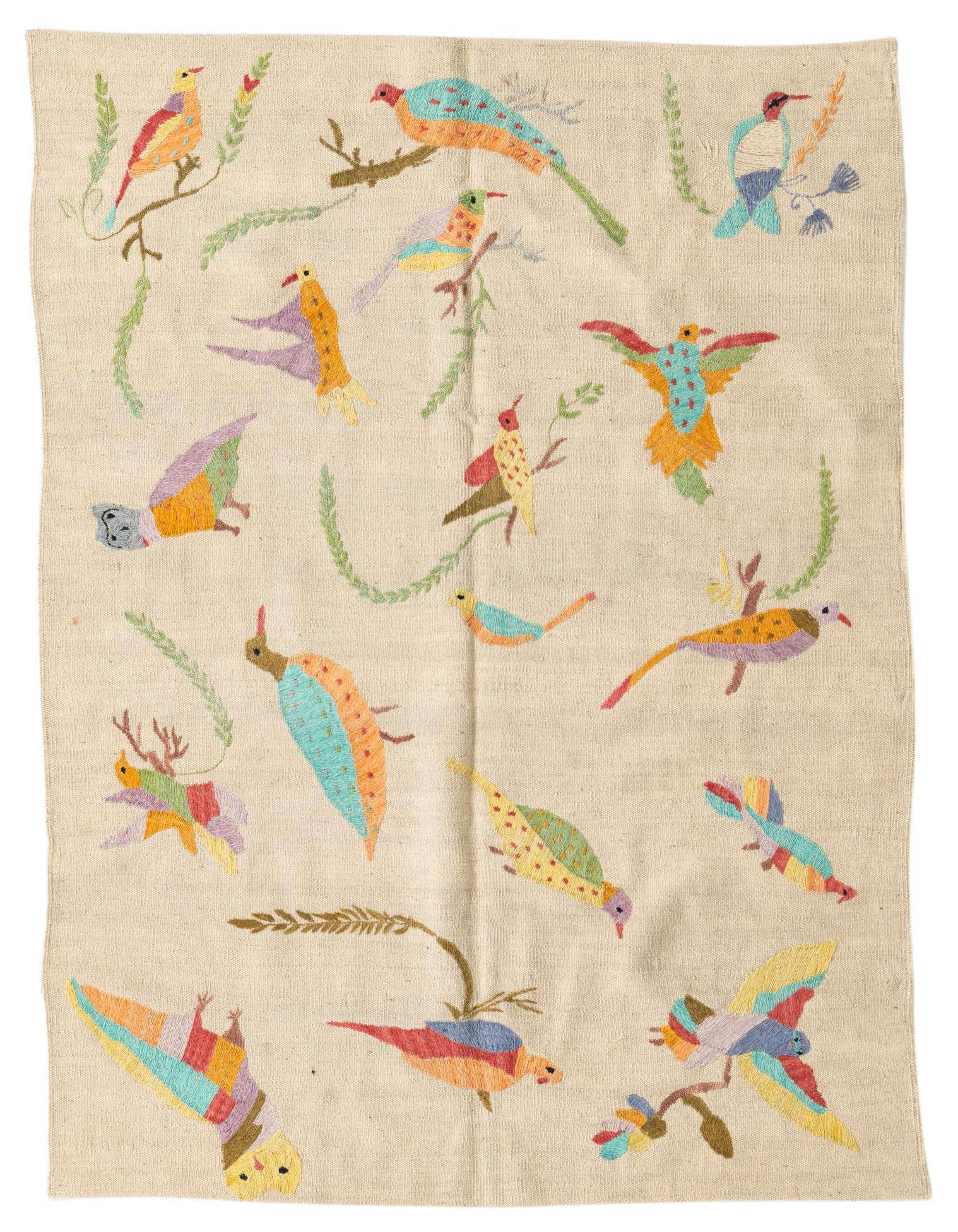 A 4x6 rectangular ivory flatweave rug features colorful embroidered birds and branches in a tribal, modern style.