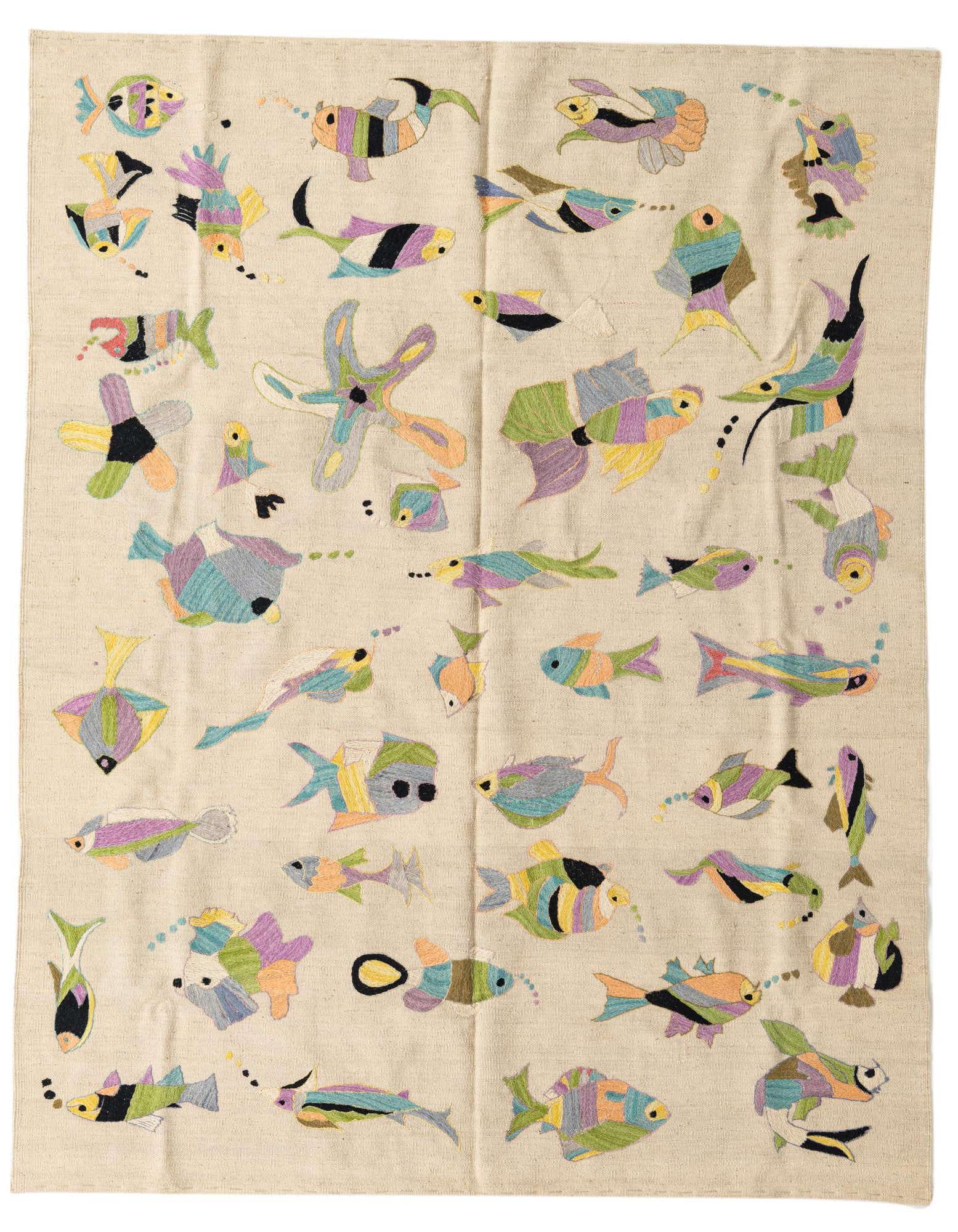 A 5x8 rectangular ivory flatweave rug features a vibrant, eclectic pattern of colorful fish and sea creatures.
