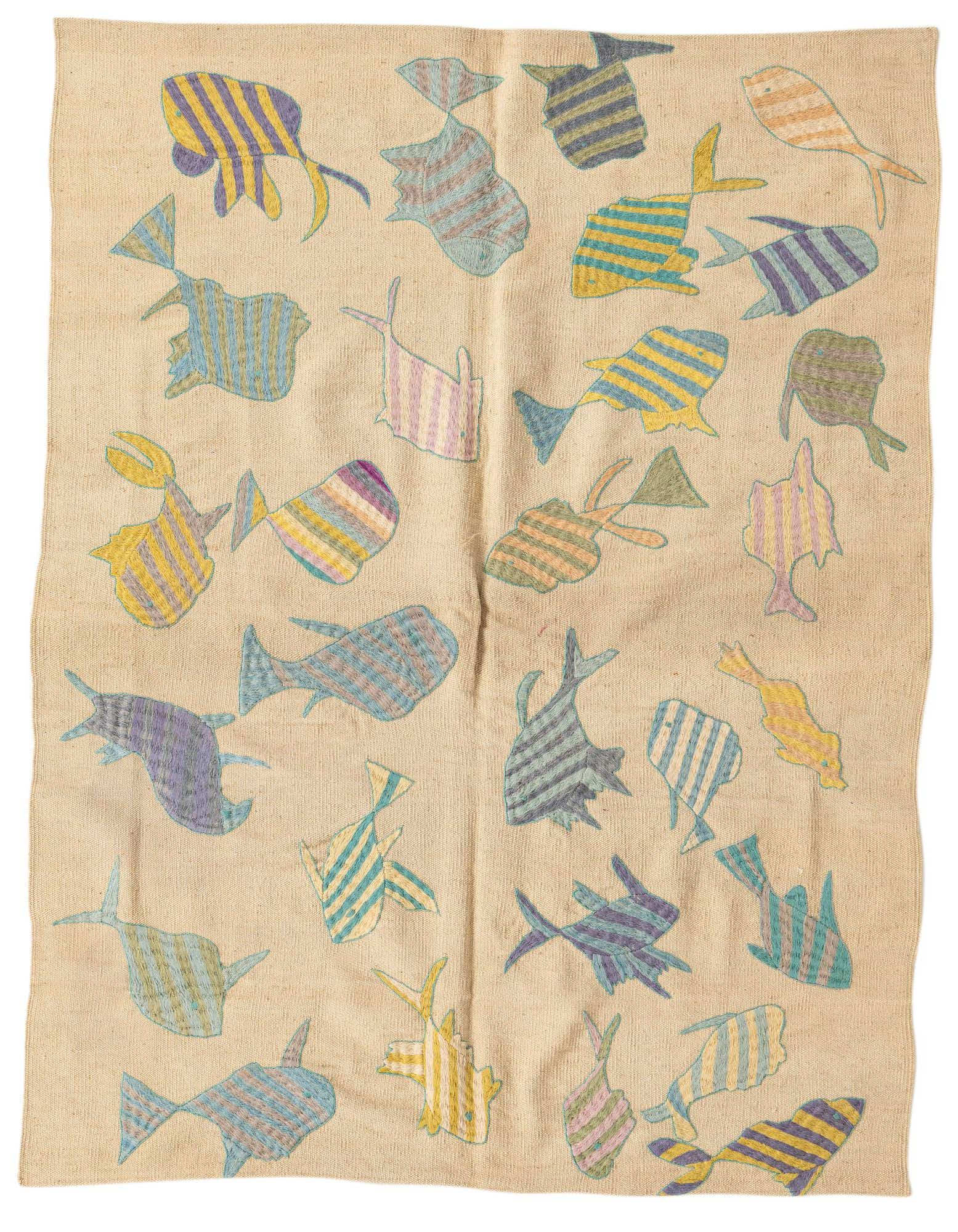 A 4x6 rectangular ivory flatweave wool rug featuring a playful, modern tribal pattern of colorful striped fish in various sizes and orientations.