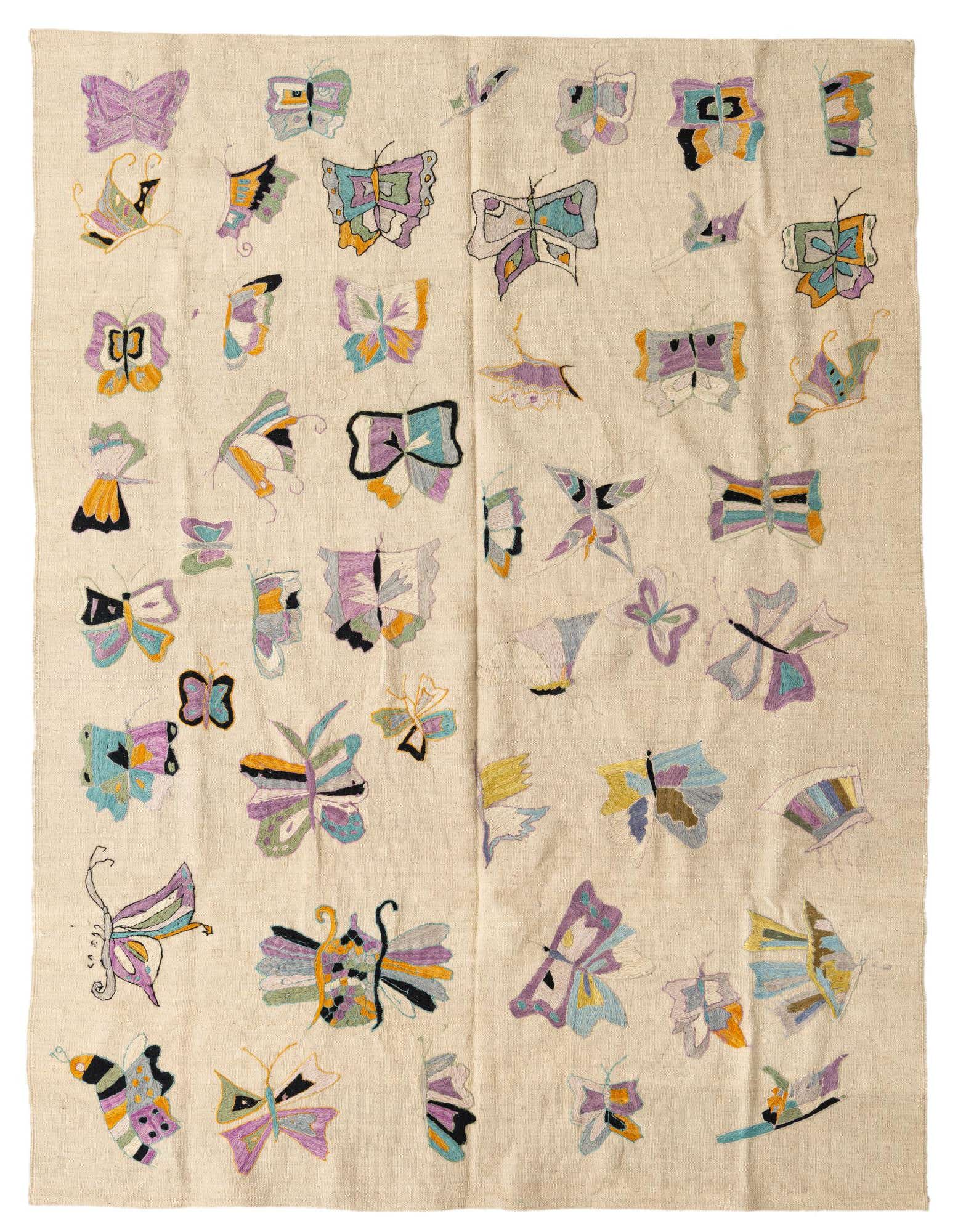 A 5x8 rectangular ivory flatweave rug featuring a vibrant, scattered butterfly pattern in various pastel and bright colors.