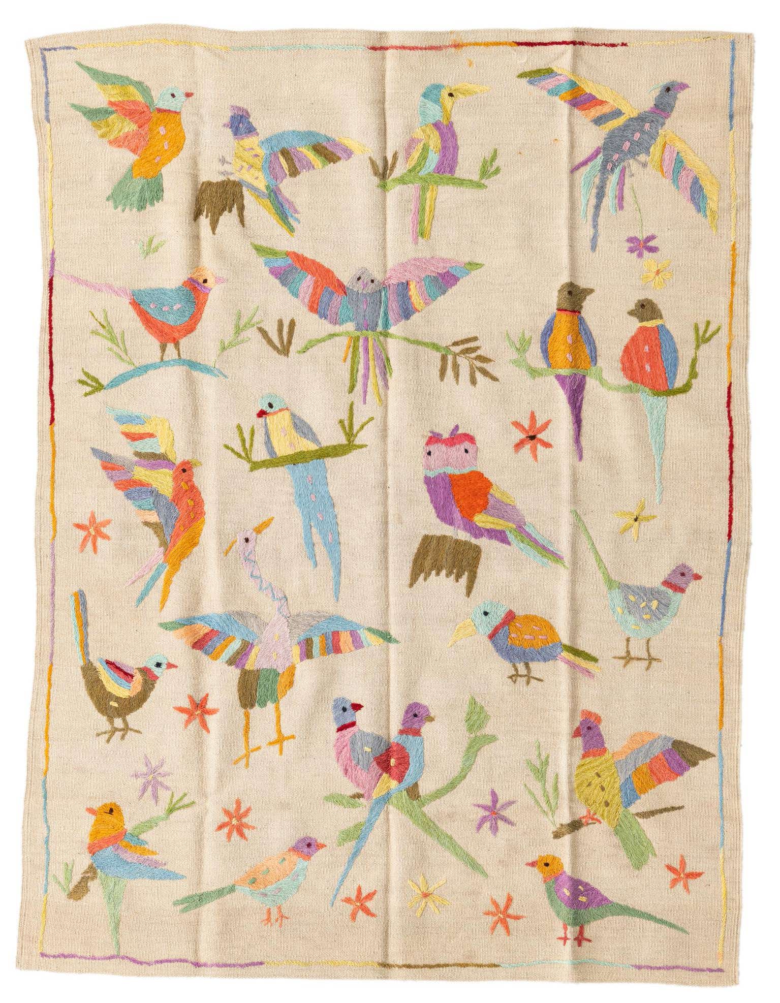 A 4x6 rectangular ivory flatweave rug featuring a vibrant, multicolored tribal bird pattern, perfect for a living room.