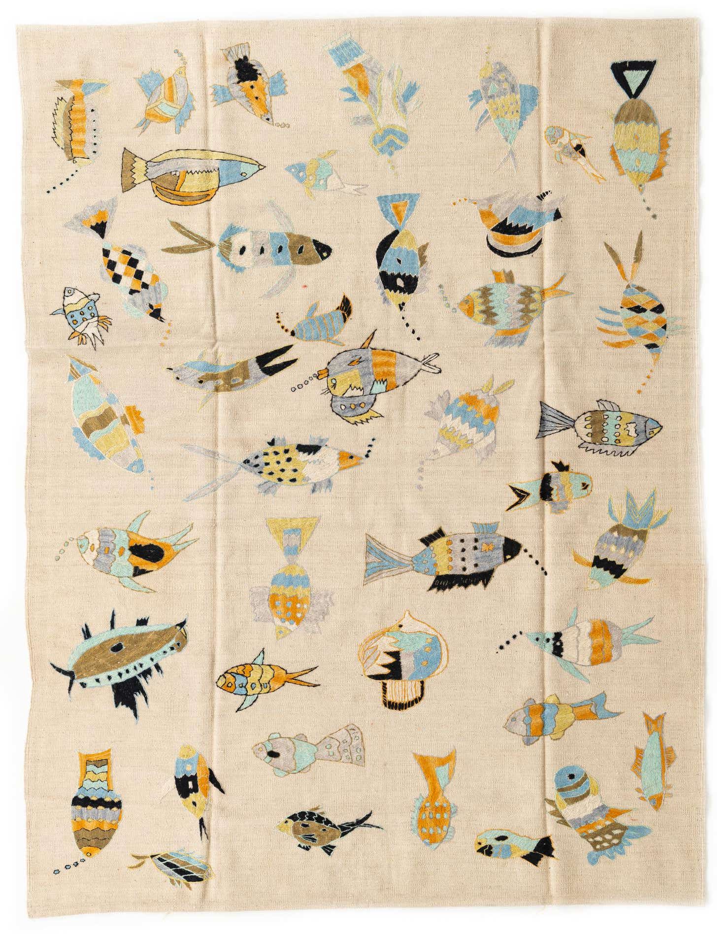 A 5x8 rectangular ivory flatweave rug featuring a playful, colorful fish pattern in blues, oranges, and browns.