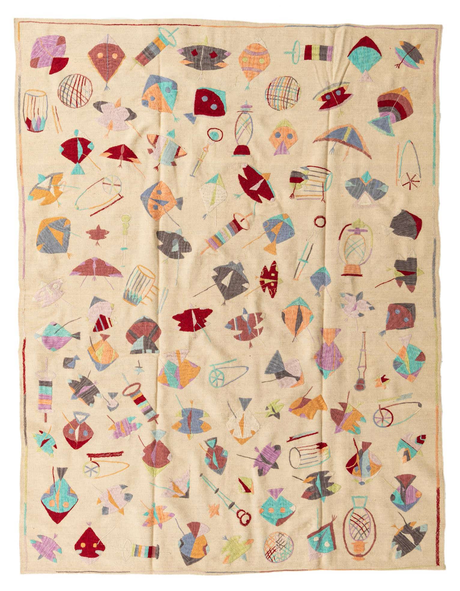 A 7x10 rectangular ivory flatweave rug with a colorful, scattered tribal kite pattern, ideal for a living room.