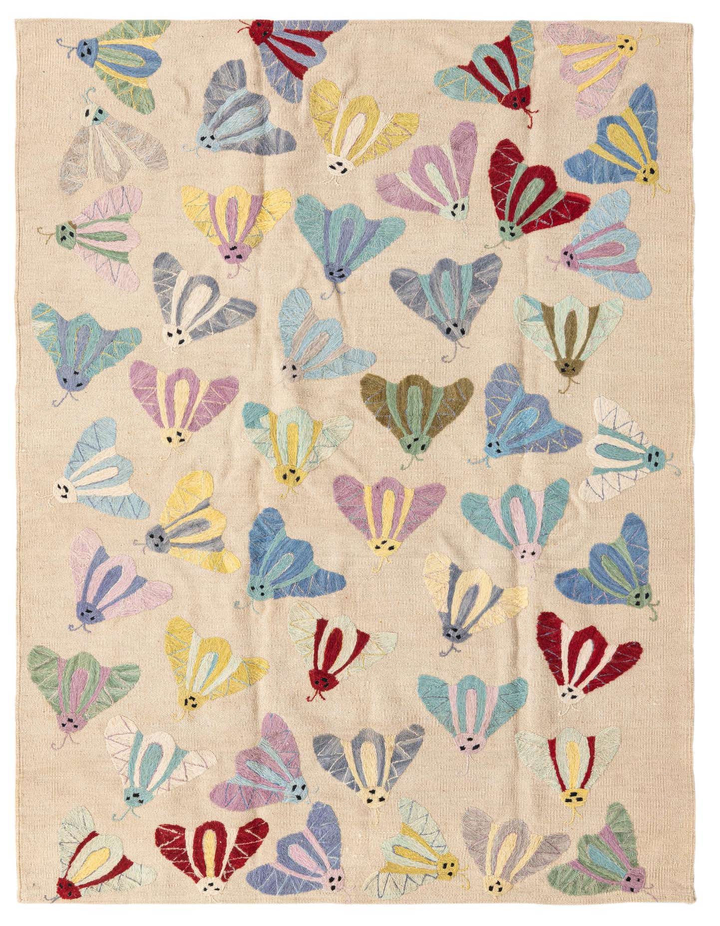 A 4x6 rectangular ivory flatweave rug featuring a vibrant, scattered pattern of colorful moths in various pastel and bold hues like blue, yellow, red, and purple.
