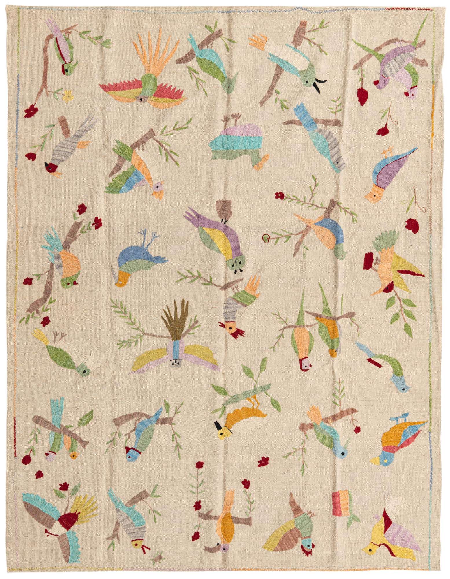 A 5x8 rectangular ivory flatweave rug featuring a vibrant, multicolored tribal bird and branch pattern, perfect for a living room.