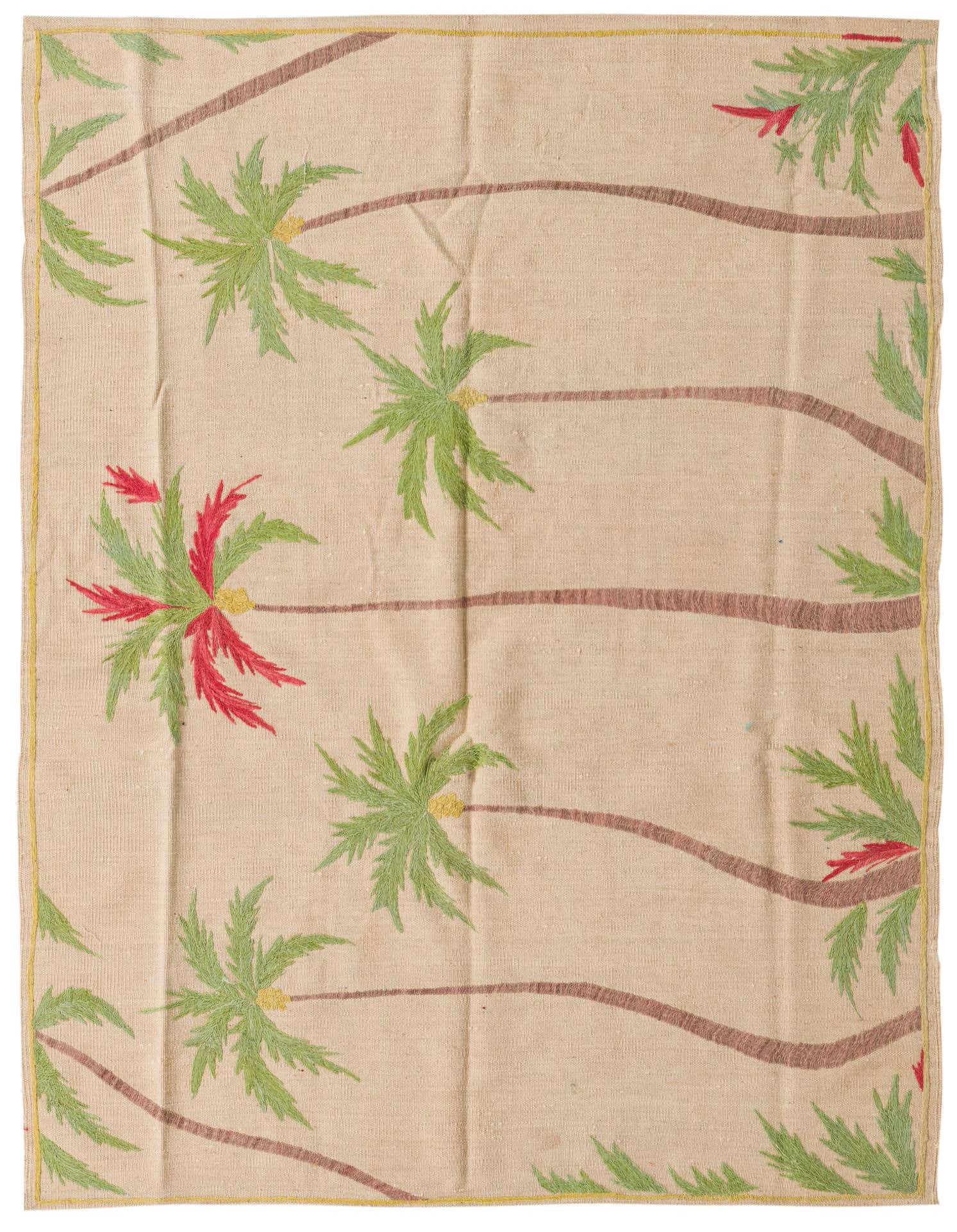 A 4x6 rectangular ivory flatweave rug with a tribal palm tree pattern in green, brown, and red.