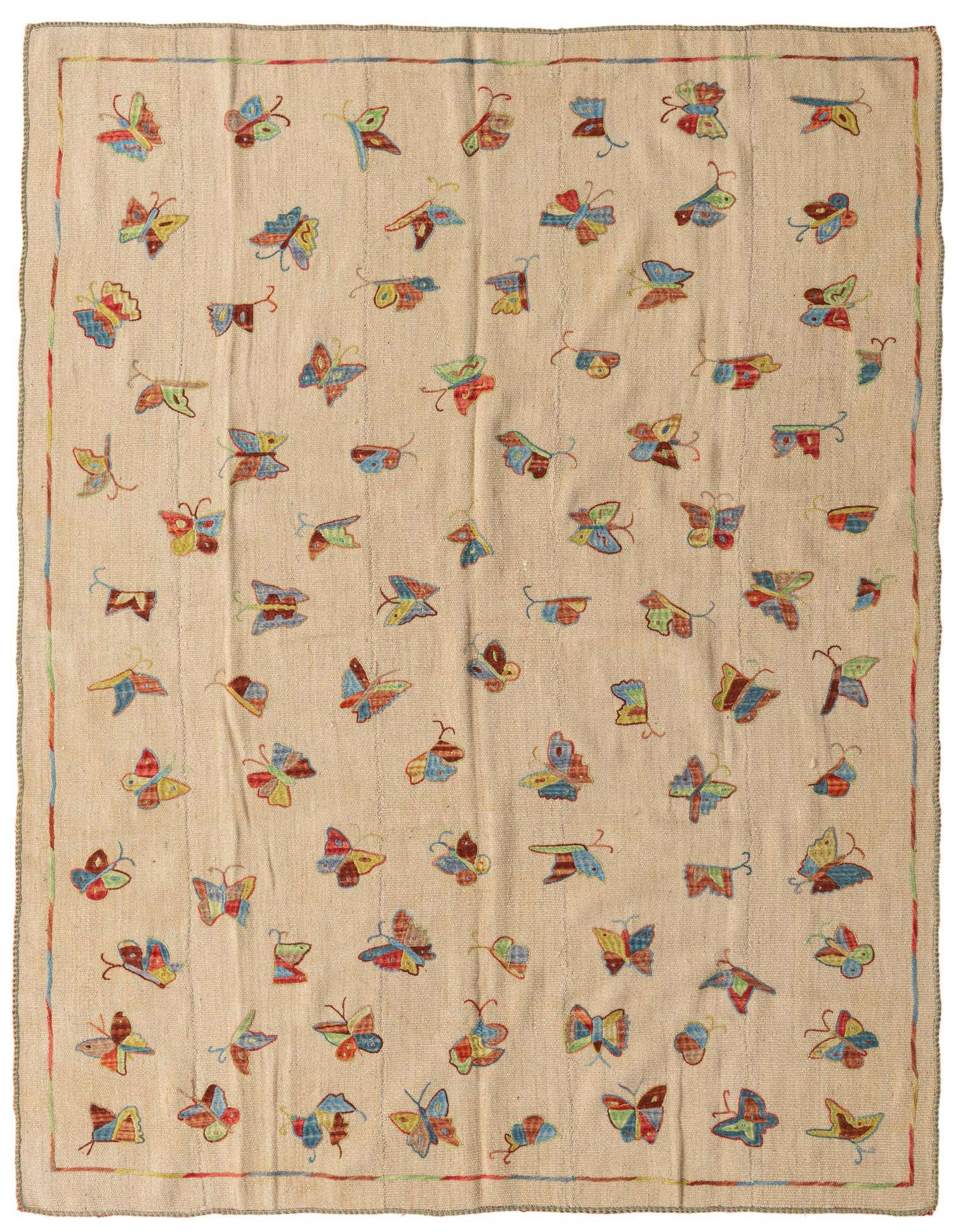 A 5x8 rectangular ivory flatweave rug features a vibrant, scattered butterfly pattern in red, blue, green, and yellow.