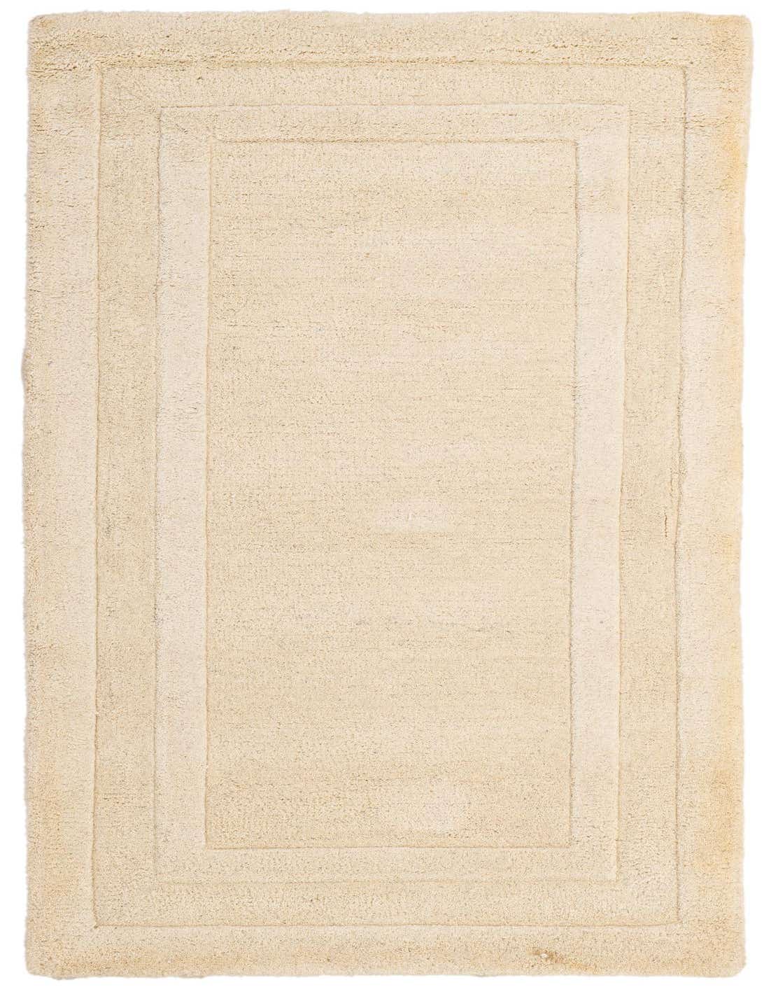 A 3x5 rectangular ivory wool rug with a subtle raised border design, suitable for indoor spaces.
