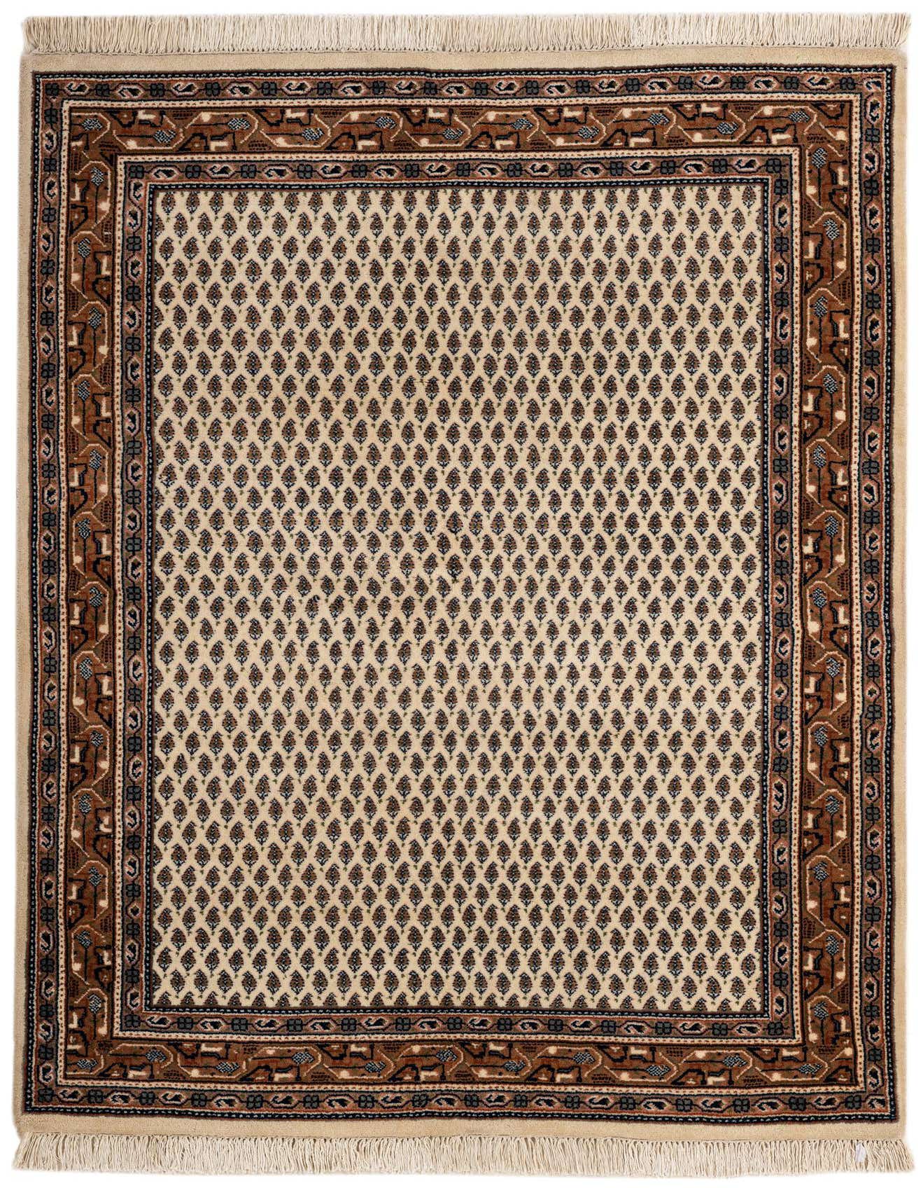 A 4x6 rectangular ivory wool rug with a traditional Oriental pattern, featuring a field of small, repeating teardrop motifs and a complex brown and blue border.