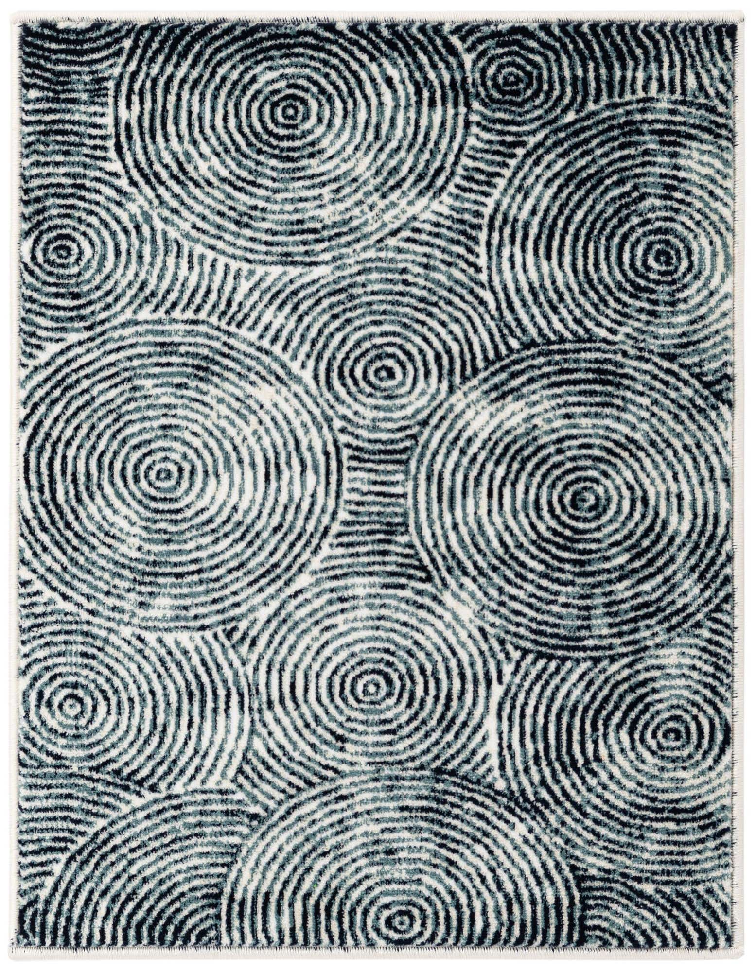 A 2x3 rectangular indoor rug featuring an abstract modern pattern of concentric dark blue and black circles on an ivory and white background.