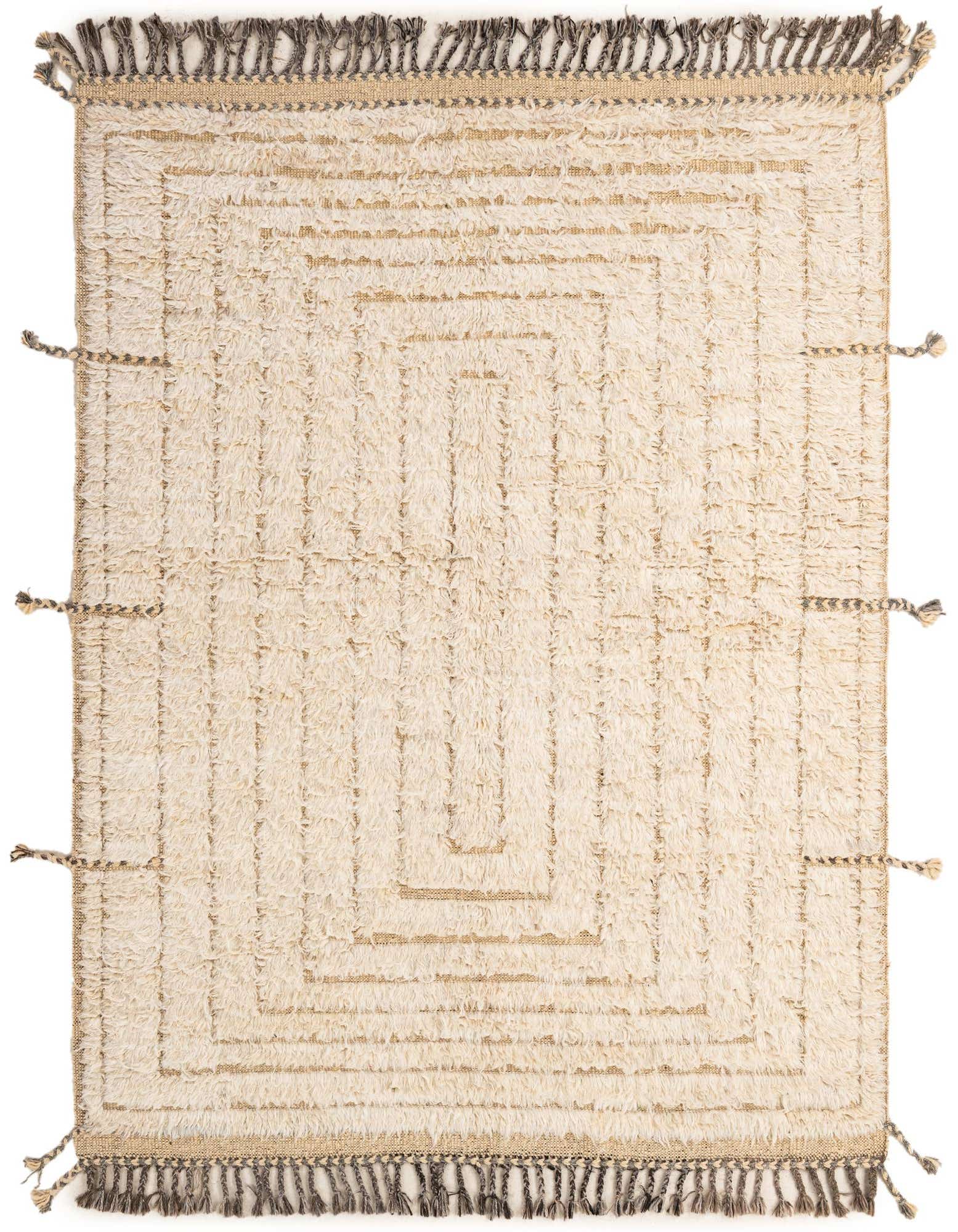 A 5x7 rectangular ivory wool rug featuring a tribal geometric pattern and decorative dark brown tassels on two ends.