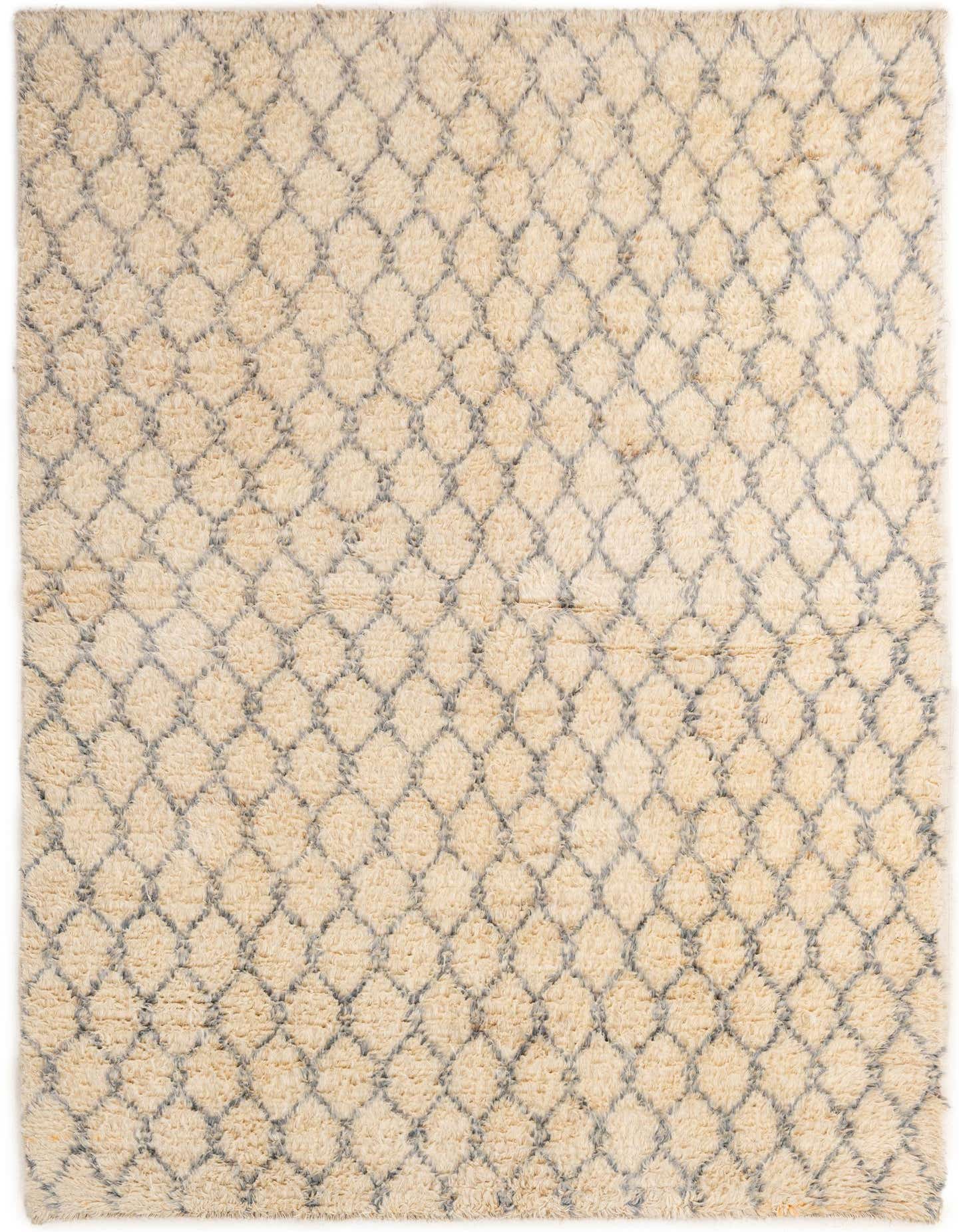 A 5x8 rectangular ivory and cream wool rug with a subtle gray tribal diamond pattern, perfect for a living room.