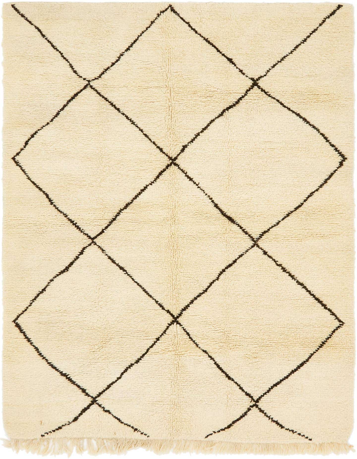 A 7x10 rectangular ivory shag rug with a bold black diamond geometric pattern, perfect for a living room.