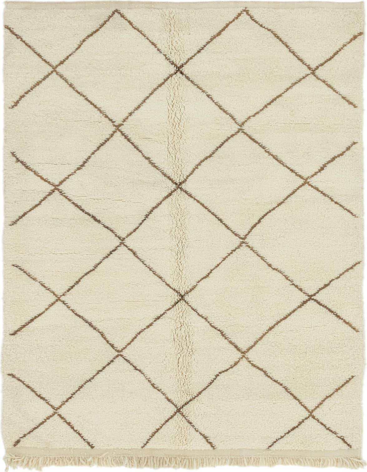 A 5x8 rectangular ivory shag rug with a brown tribal diamond pattern and fringe, suitable for a living room.