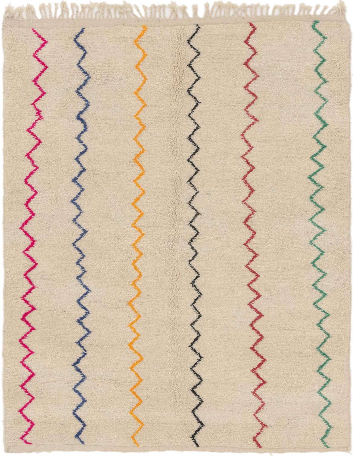 A 5x8 rectangular ivory shag rug with colorful vertical zigzag stripes in pink, blue, orange, black, red, and green.