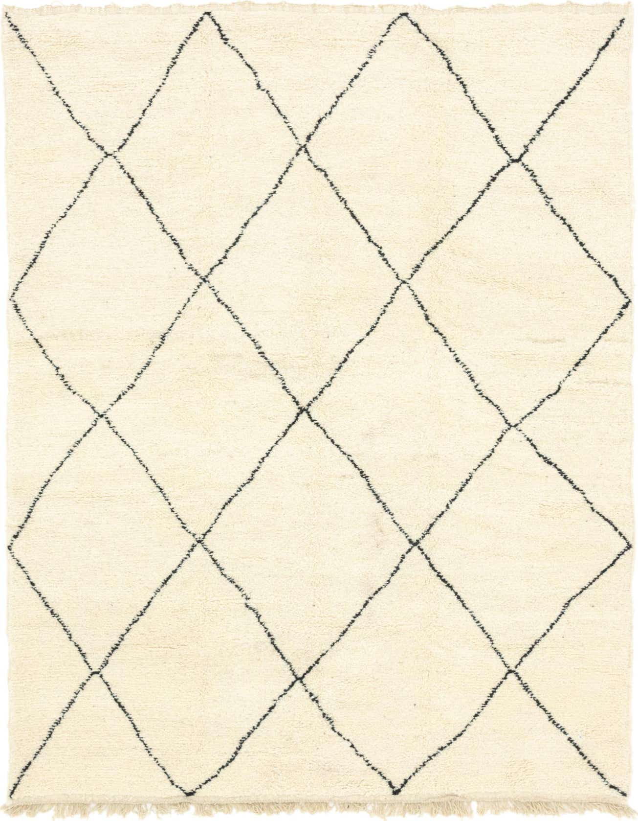 A 6x9 rectangular ivory shag rug with a black diamond trellis pattern, ideal for a living room.