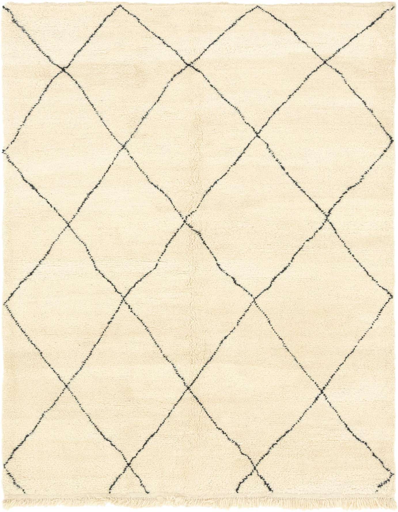 A 7x10 rectangular ivory shag rug with a black tribal diamond pattern, ideal for a living room.
