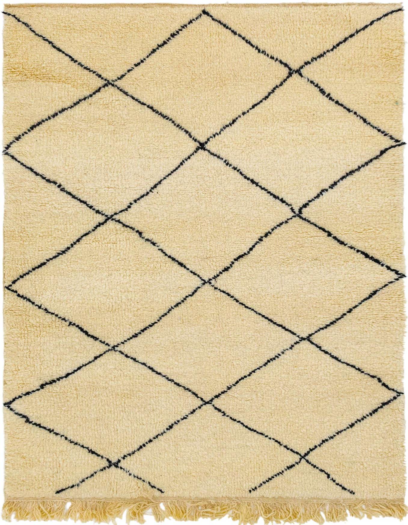 A 5x8 rectangular ivory shag rug with a black tribal diamond pattern and fringed ends, ideal for a living room.