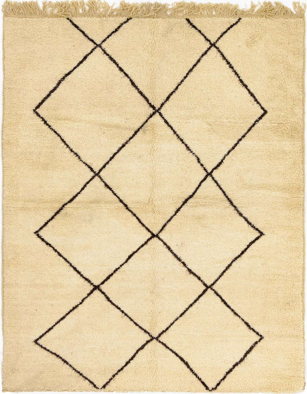 A 5x8 rectangular ivory shag rug with a bold black tribal diamond pattern, ideal for a living room or bedroom.