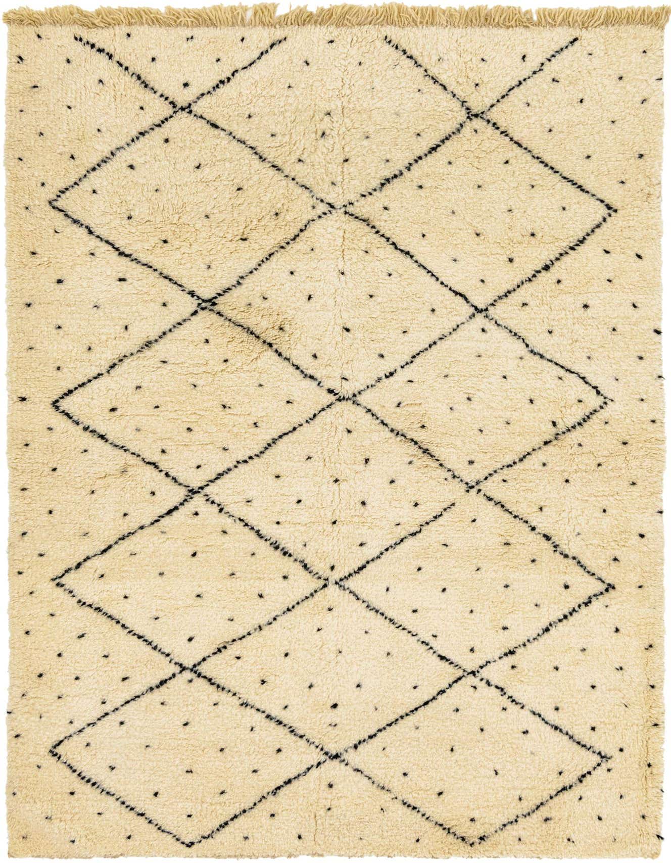 A 6x9 rectangular ivory shag rug with a black tribal diamond pattern and small black dots.