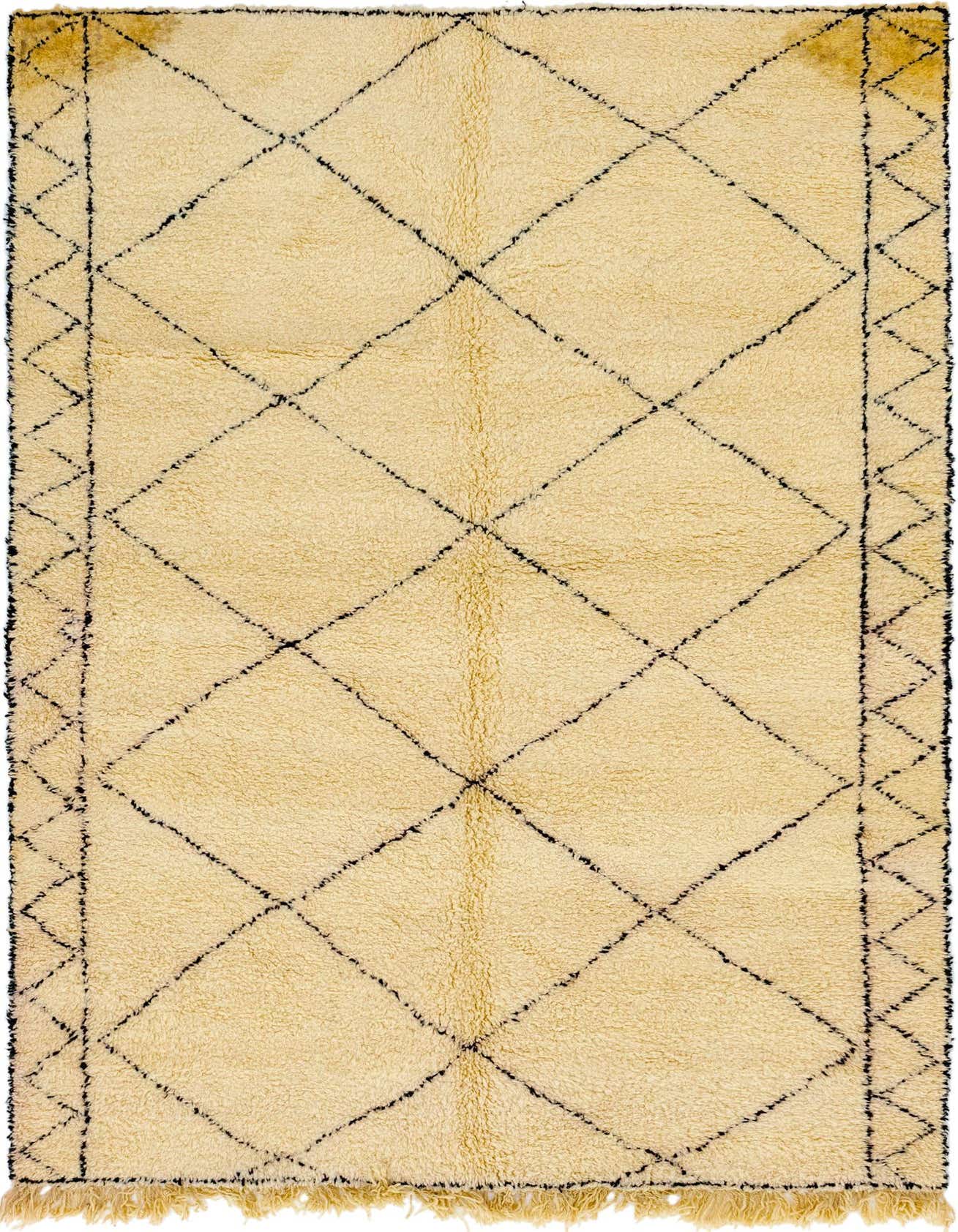 A 7x10 rectangular ivory shag rug with a black tribal diamond pattern and fringed edges, suitable for a living room.