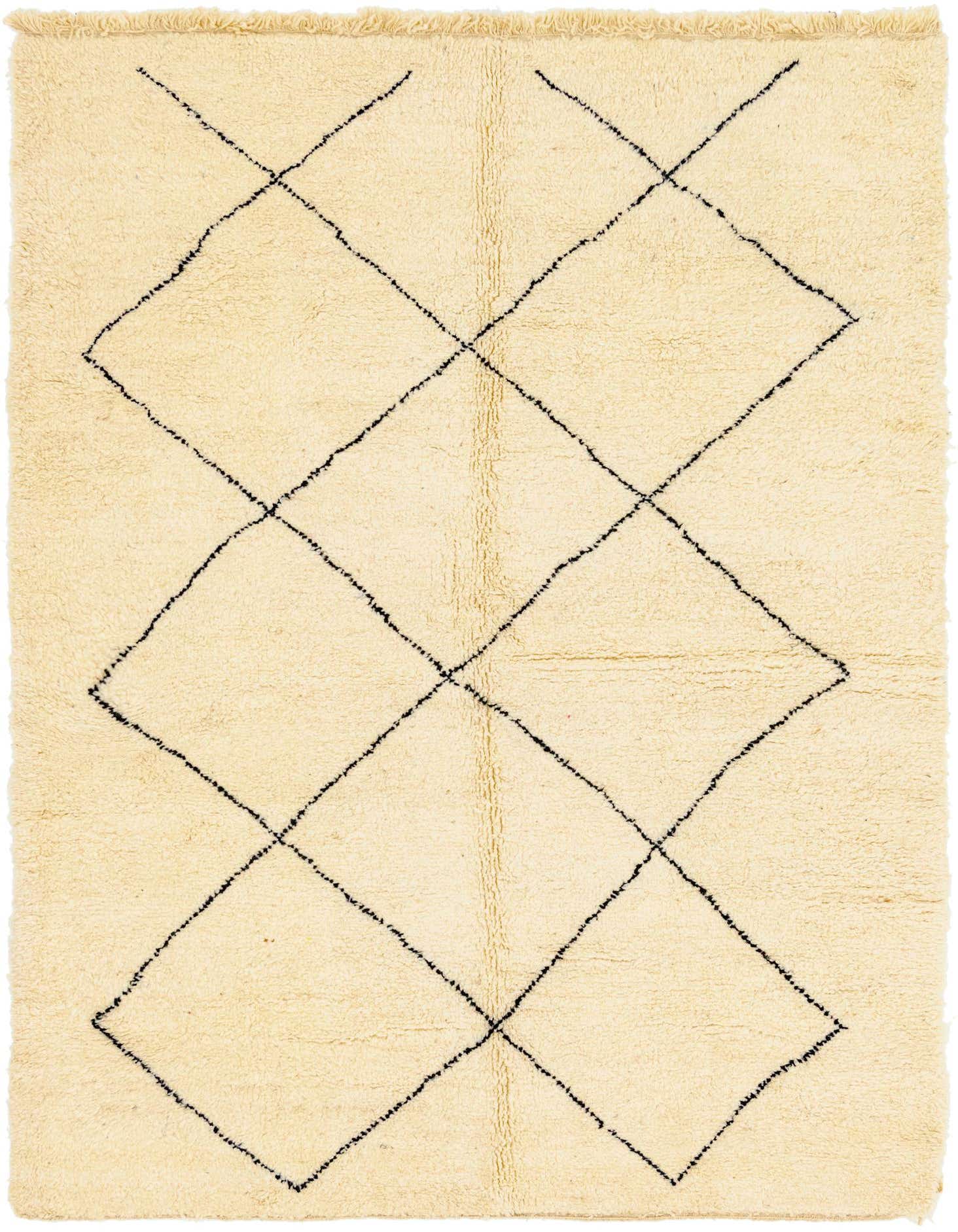 A 7x10 rectangular ivory shag rug with a bold black tribal diamond pattern, perfect for a modern living room.