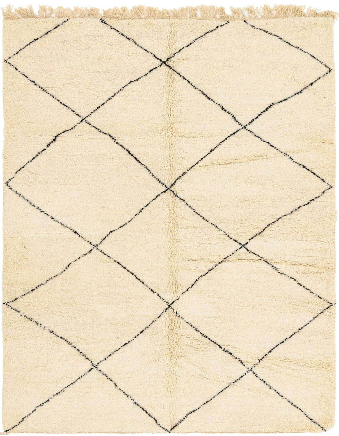 A 7x10 rectangular ivory shag rug with a black tribal diamond pattern, featuring fringes, suitable for a living room.