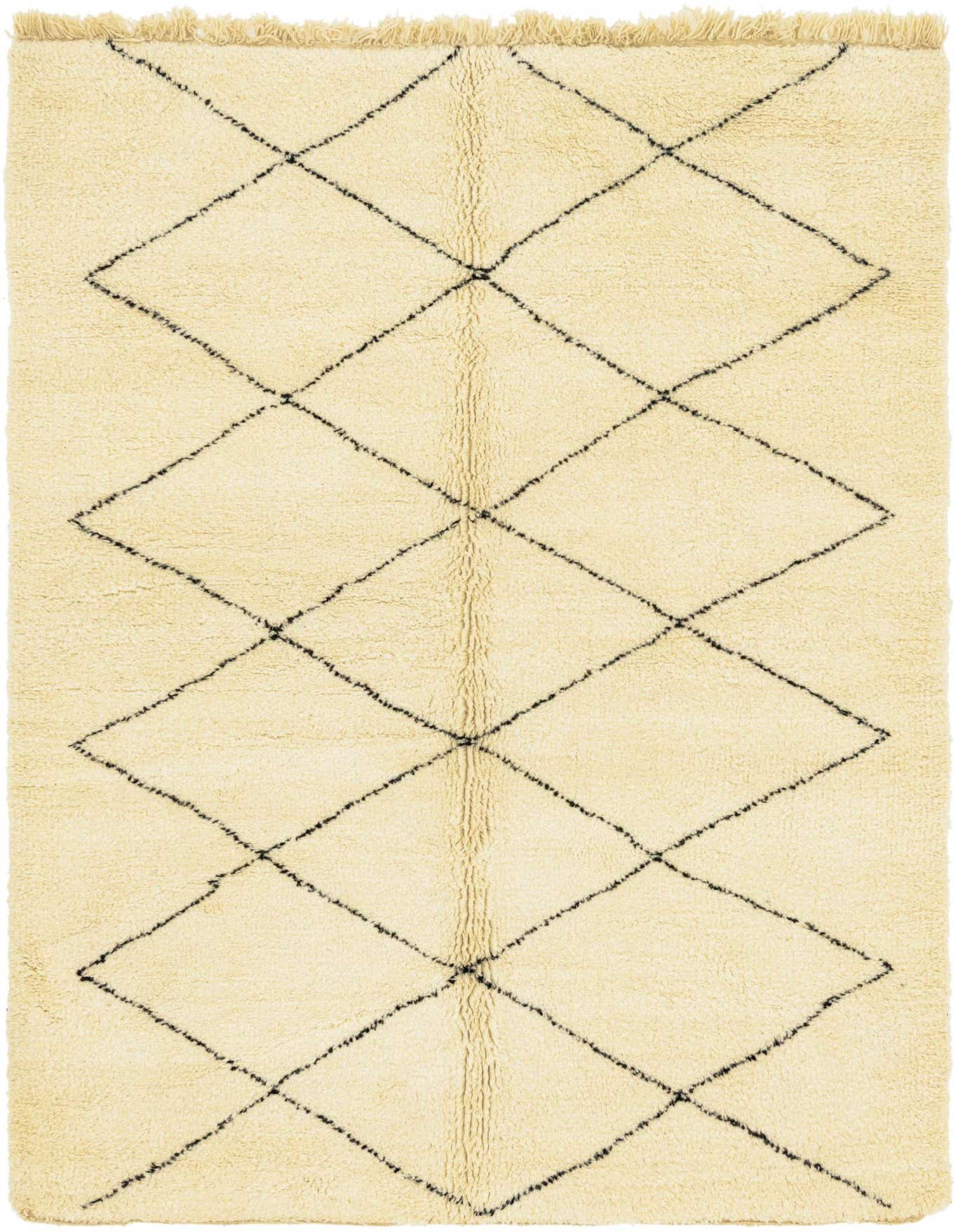 A 7x10 rectangular ivory shag rug with a black tribal diamond pattern and fringed ends, suitable for a living room.