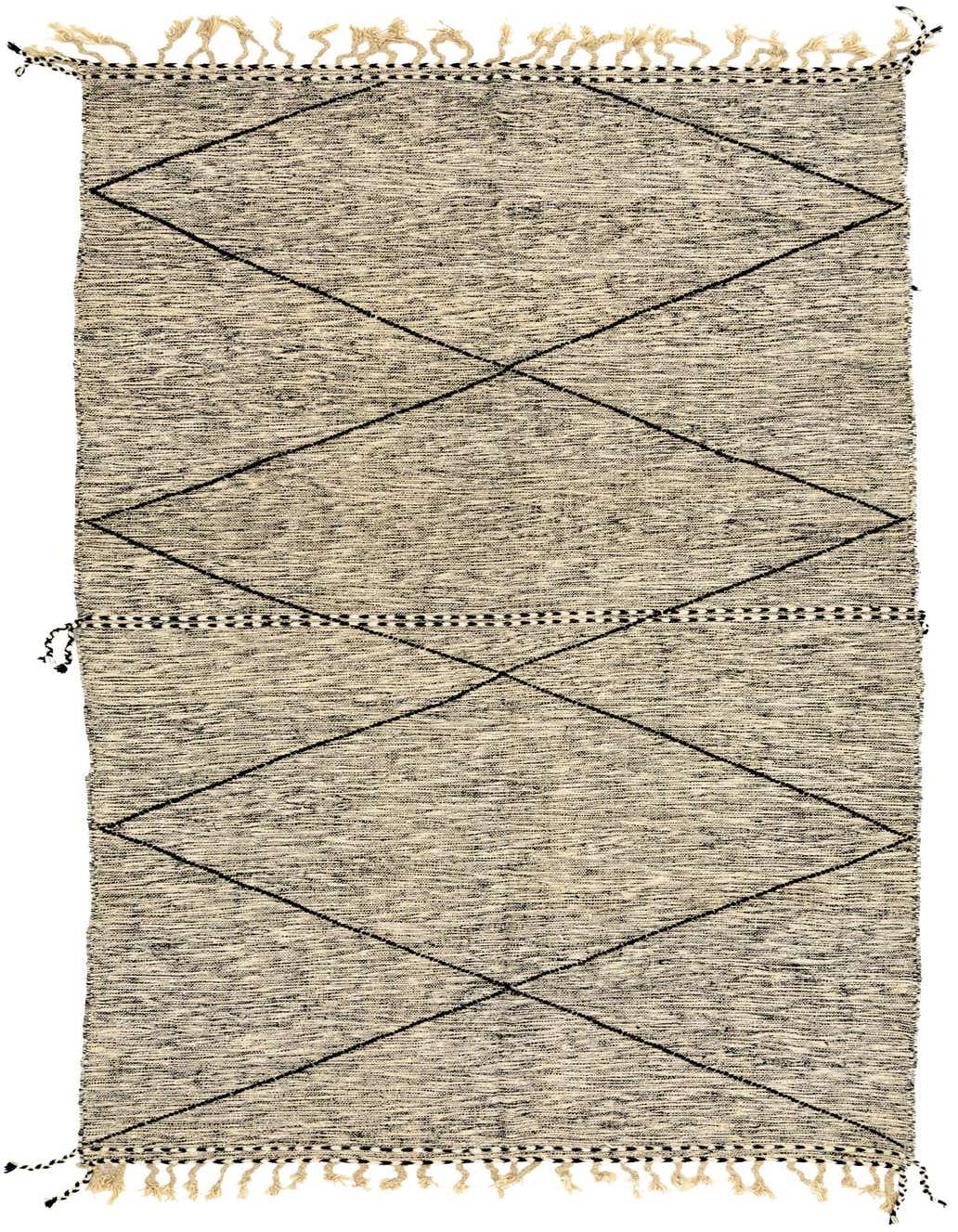 A 10x13 rectangular ivory shag rug with a black tribal diamond pattern and fringe tassels, ideal for a living room.