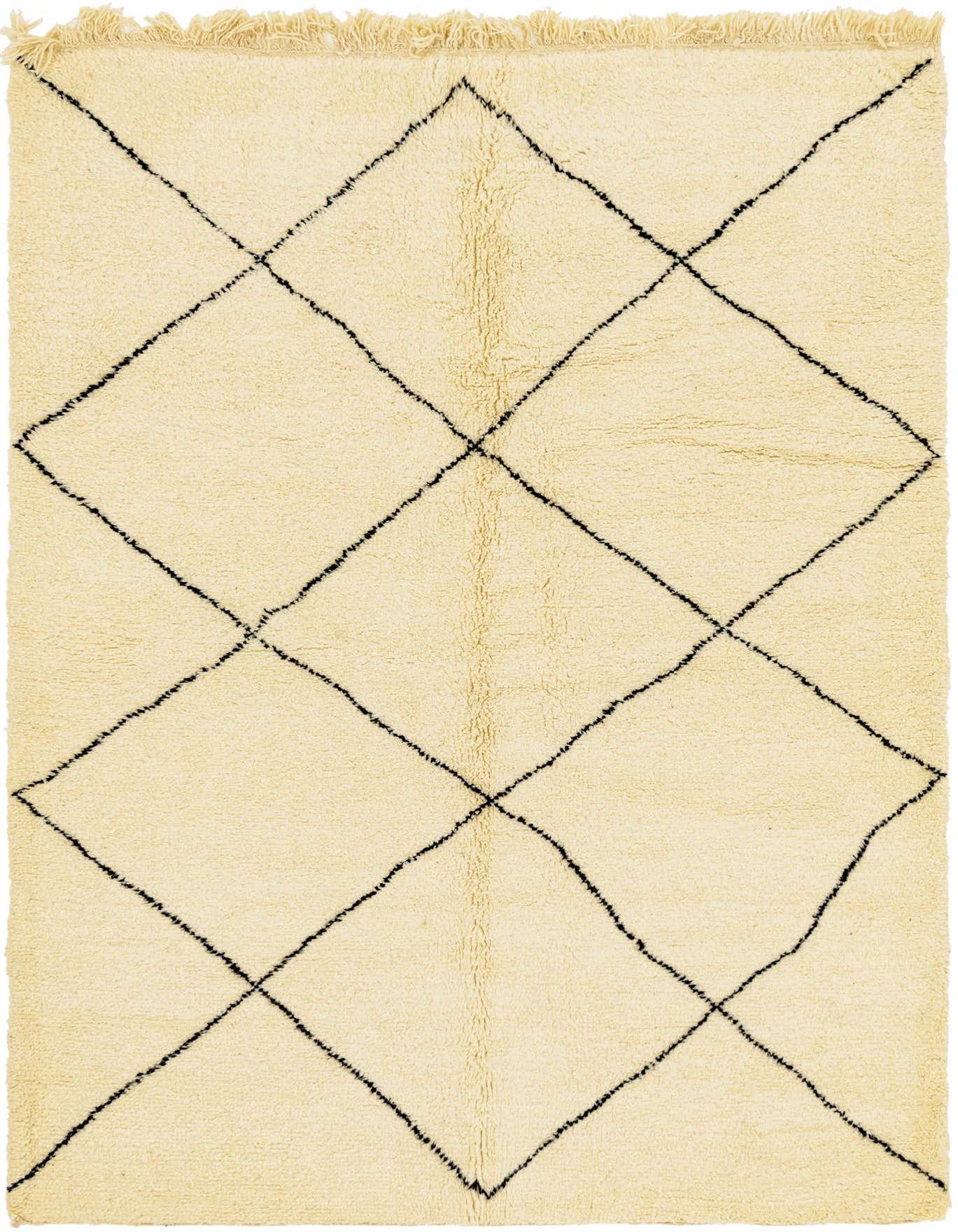 A 6x9 rectangular ivory shag rug with a black tribal diamond pattern, featuring visible fringe.