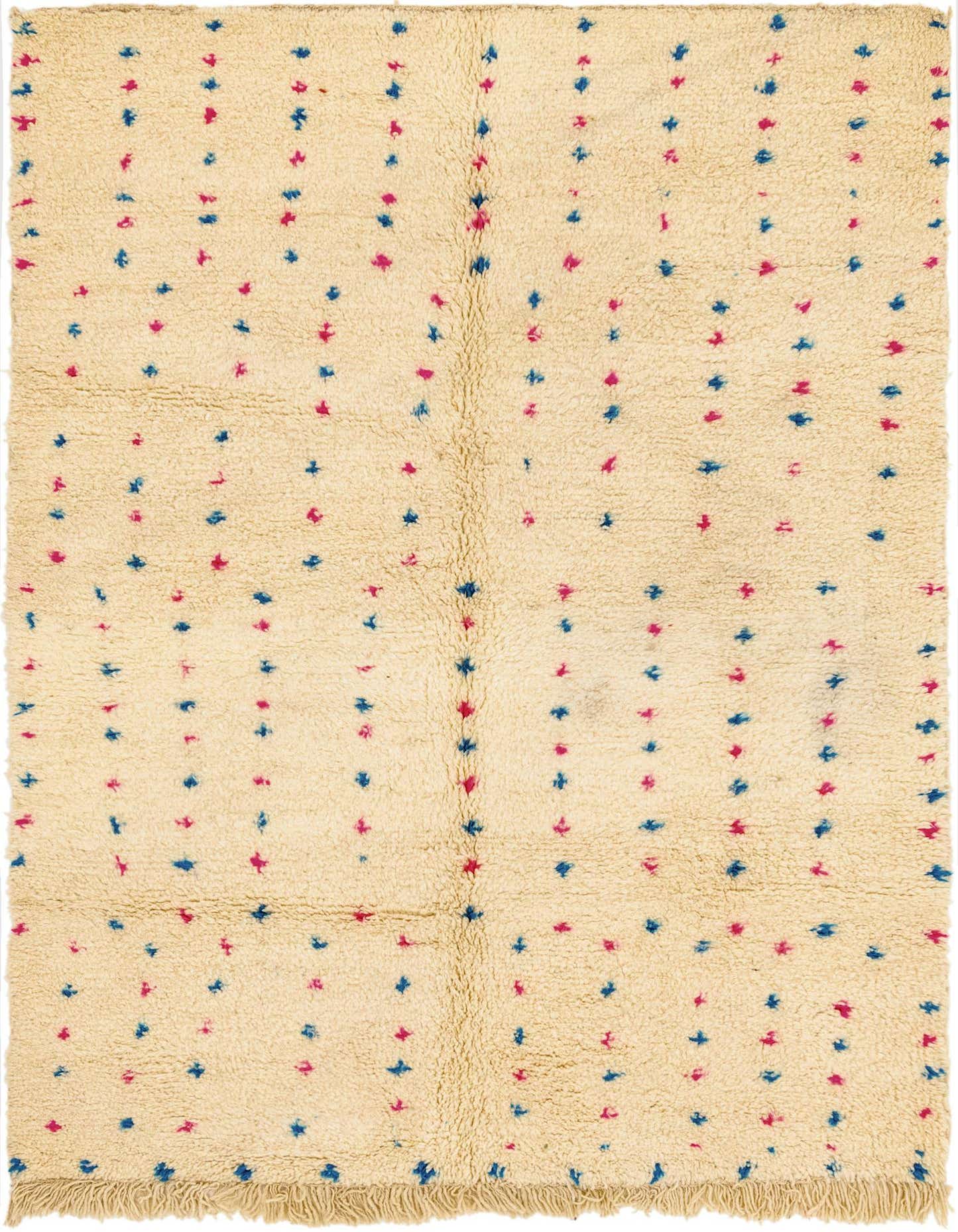 A 5x7 rectangular ivory shag rug with a tribal pattern of scattered small blue and pink abstract shapes.