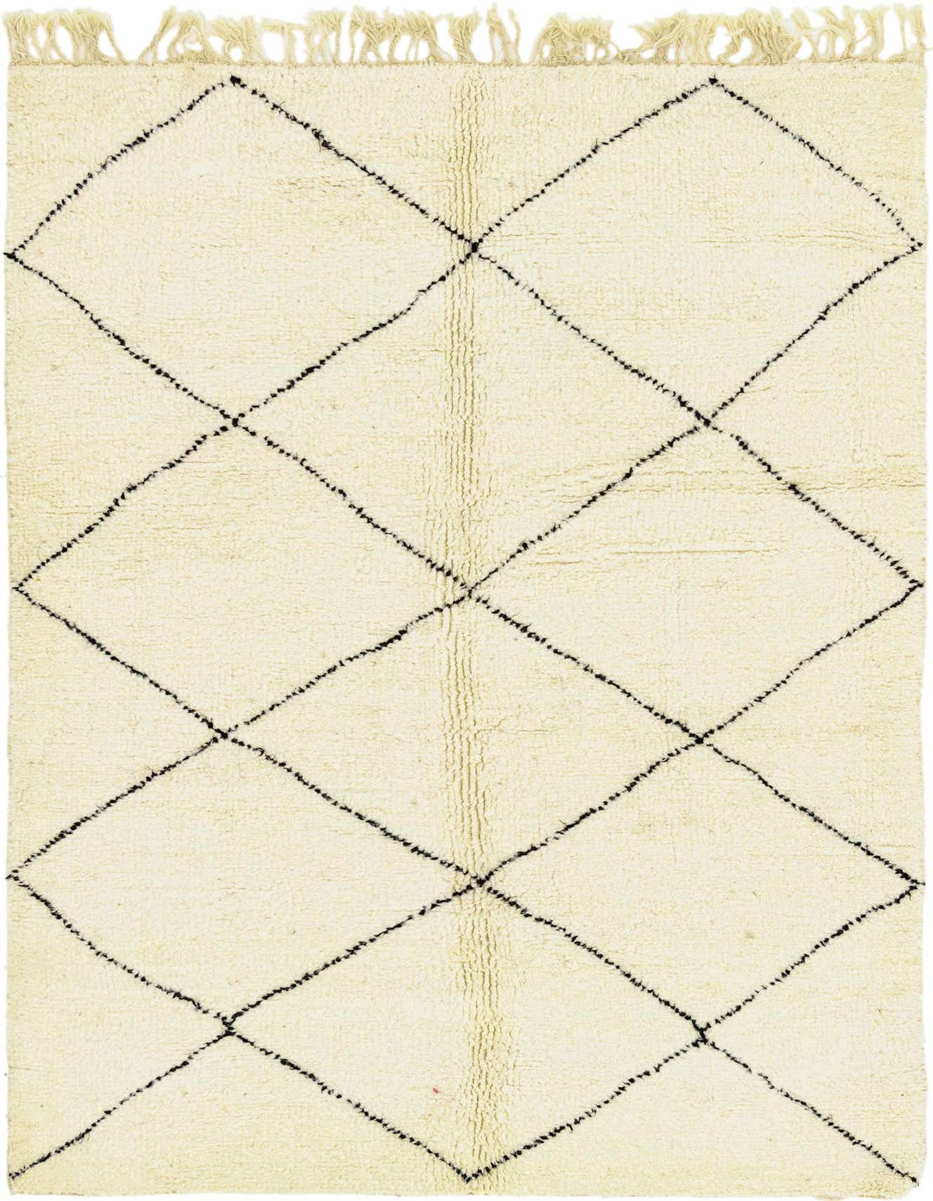 A 5x8 rectangular ivory shag rug with a black tribal diamond pattern and fringed ends, suitable for a living room.