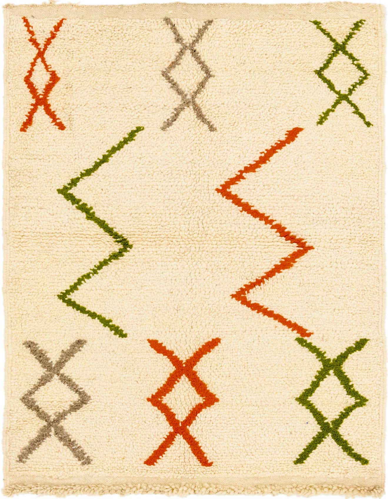 A 3x5 rectangular ivory shag rug with a modern tribal pattern featuring orange, green, and gray geometric shapes.