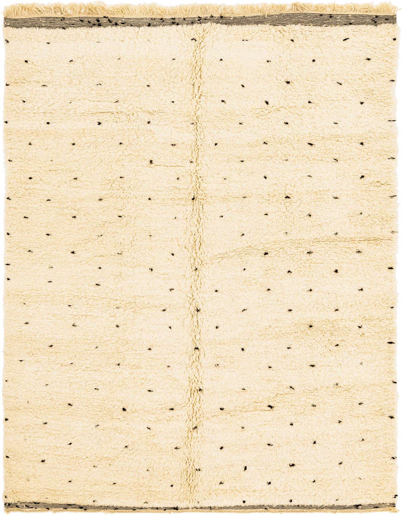 A rectangular 7x10 ivory shag rug with scattered black abstract dots and a tribal pattern, perfect for a modern living room.