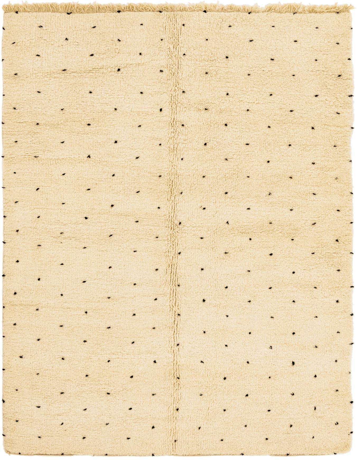 A 7x10 rectangular ivory shag rug with small, irregularly spaced black tribal dots, suitable for a living room.