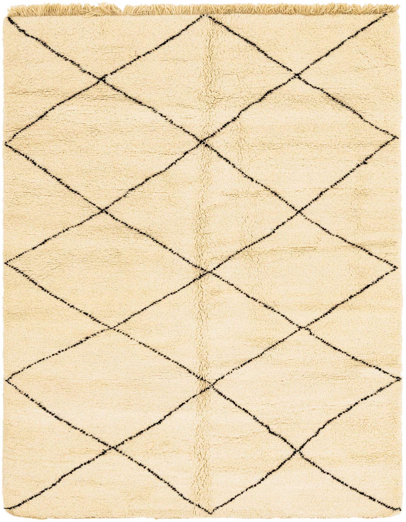 A 6x9 rectangular ivory shag rug with a black tribal diamond pattern and fringe, perfect for a living room.