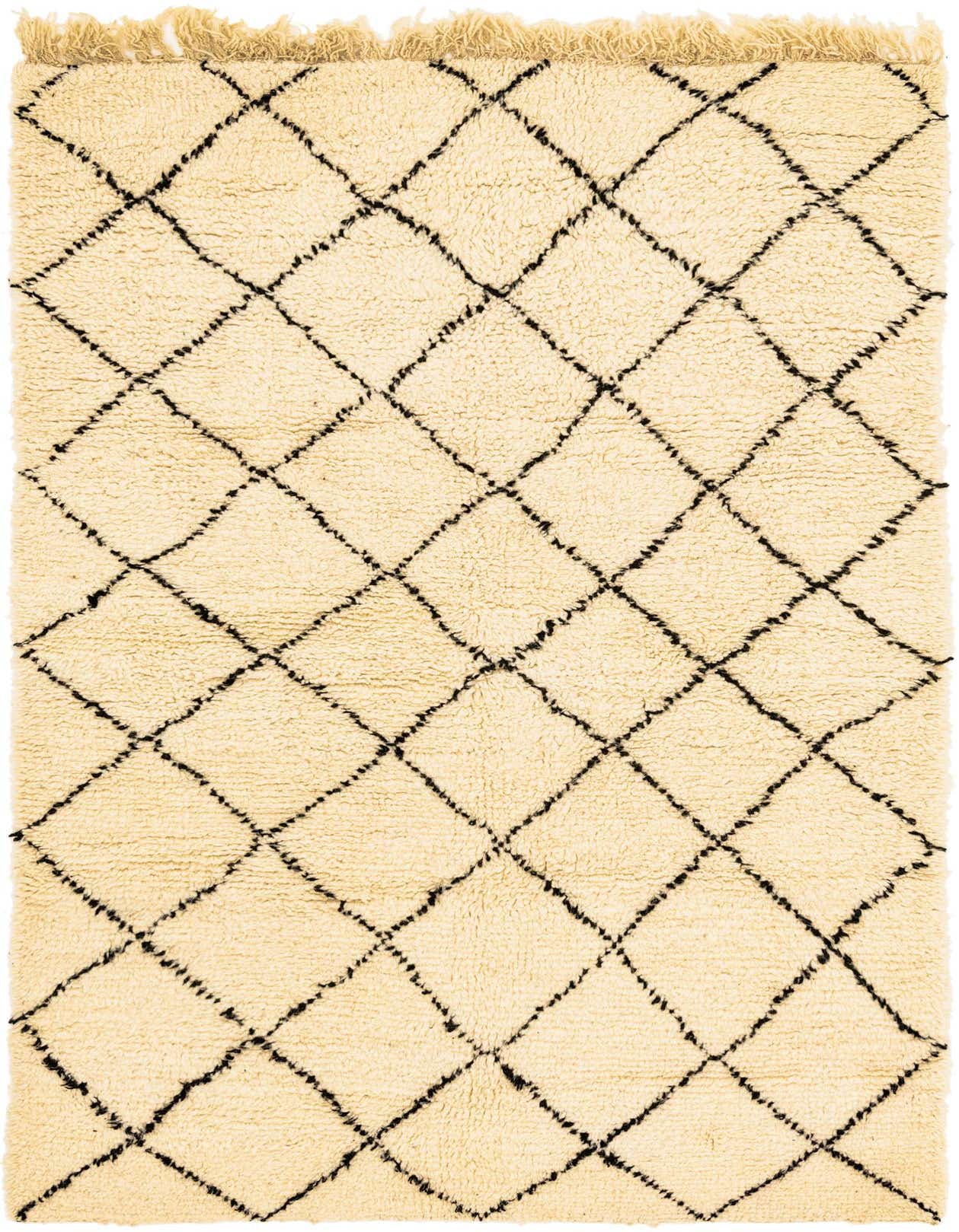 A 5x8 rectangular ivory shag rug with a black tribal diamond pattern and fringe, perfect for a living room.