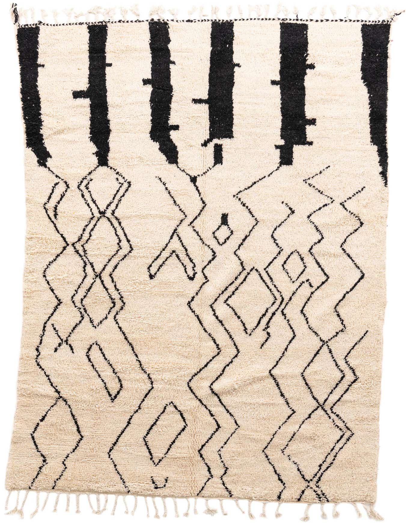 A 6x9 rectangular ivory shag rug with bold black tribal patterns and fringe on a white background.