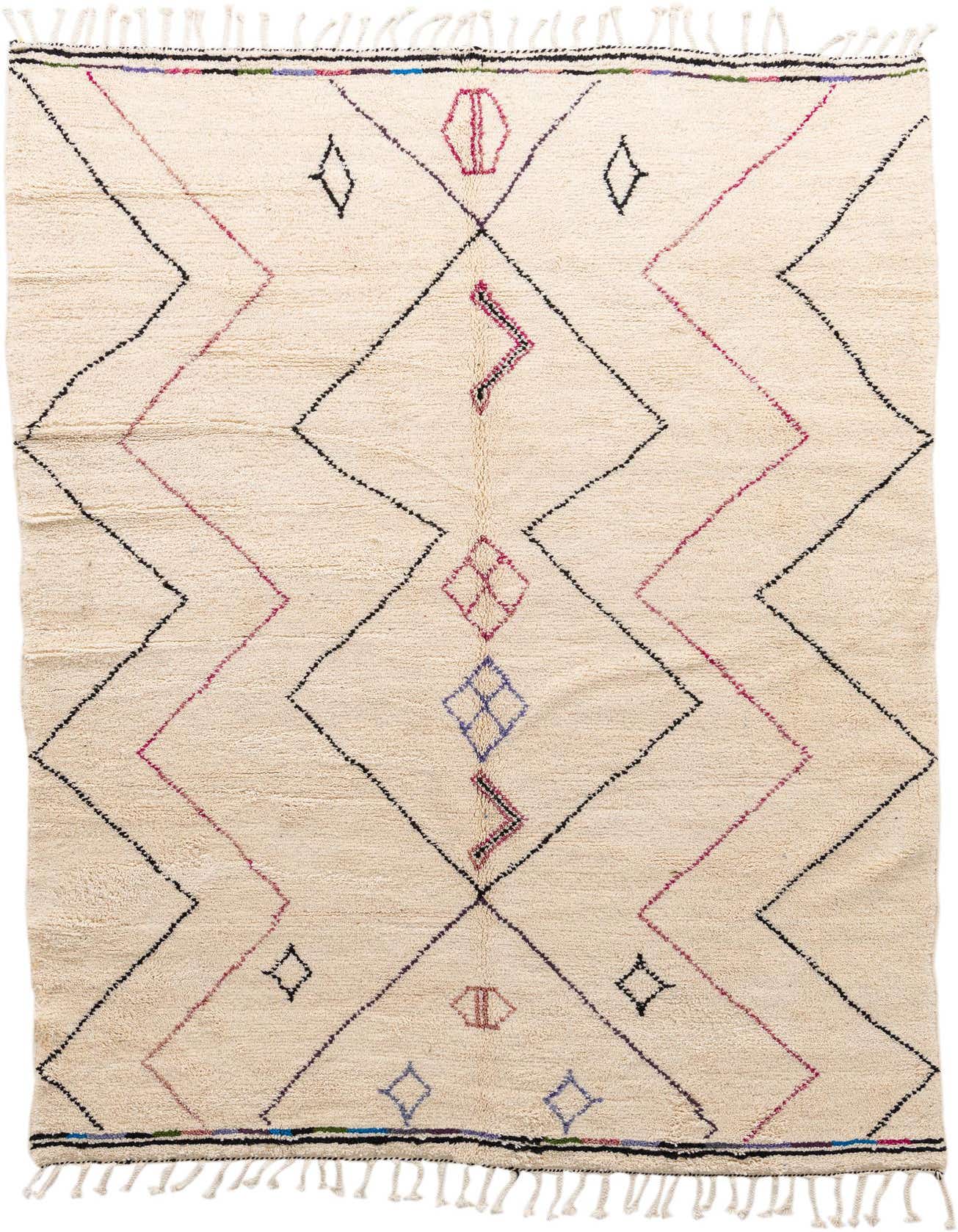 A 7x10 rectangular ivory shag rug with a tribal geometric pattern in black, pink, and blue, featuring tassels.