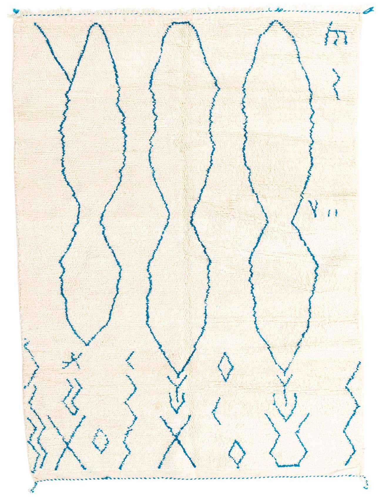 A 5x8 rectangular ivory shag rug with abstract teal blue tribal patterns, suitable for a living room or bedroom.