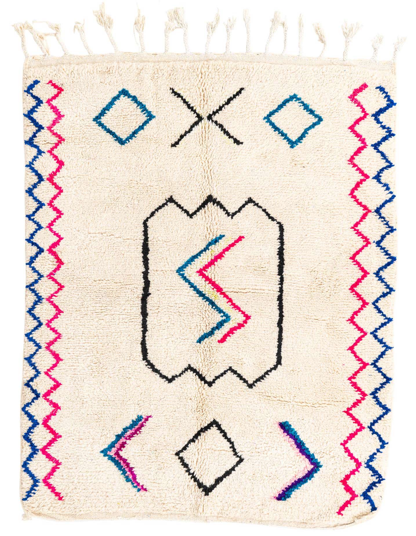 A 4x6 rectangular ivory shag rug with colorful tribal and abstract patterns in blue, pink, and black, featuring tassels.