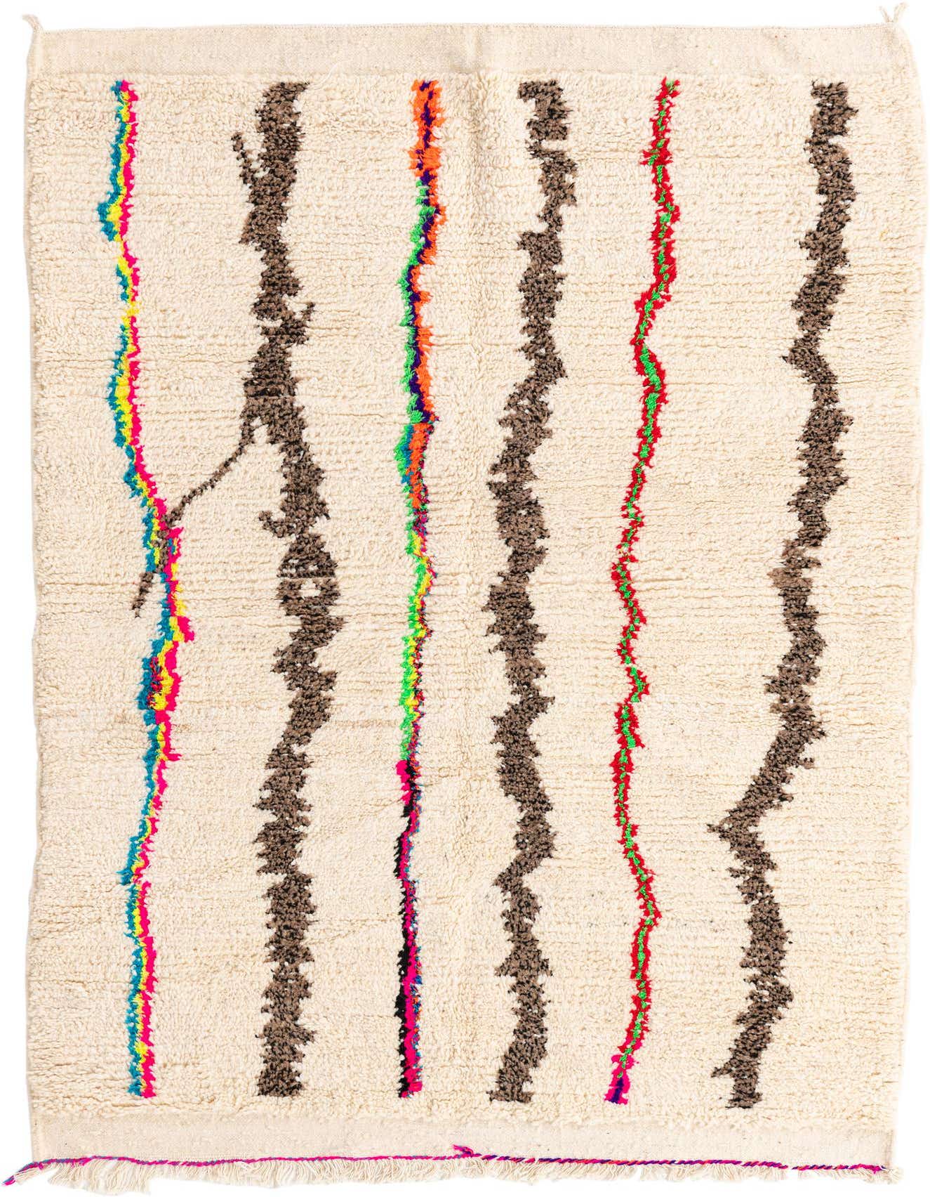 A 5x7 rectangular ivory shag rug with abstract brown and colorful tribal stripes, perfect for an indoor living space.