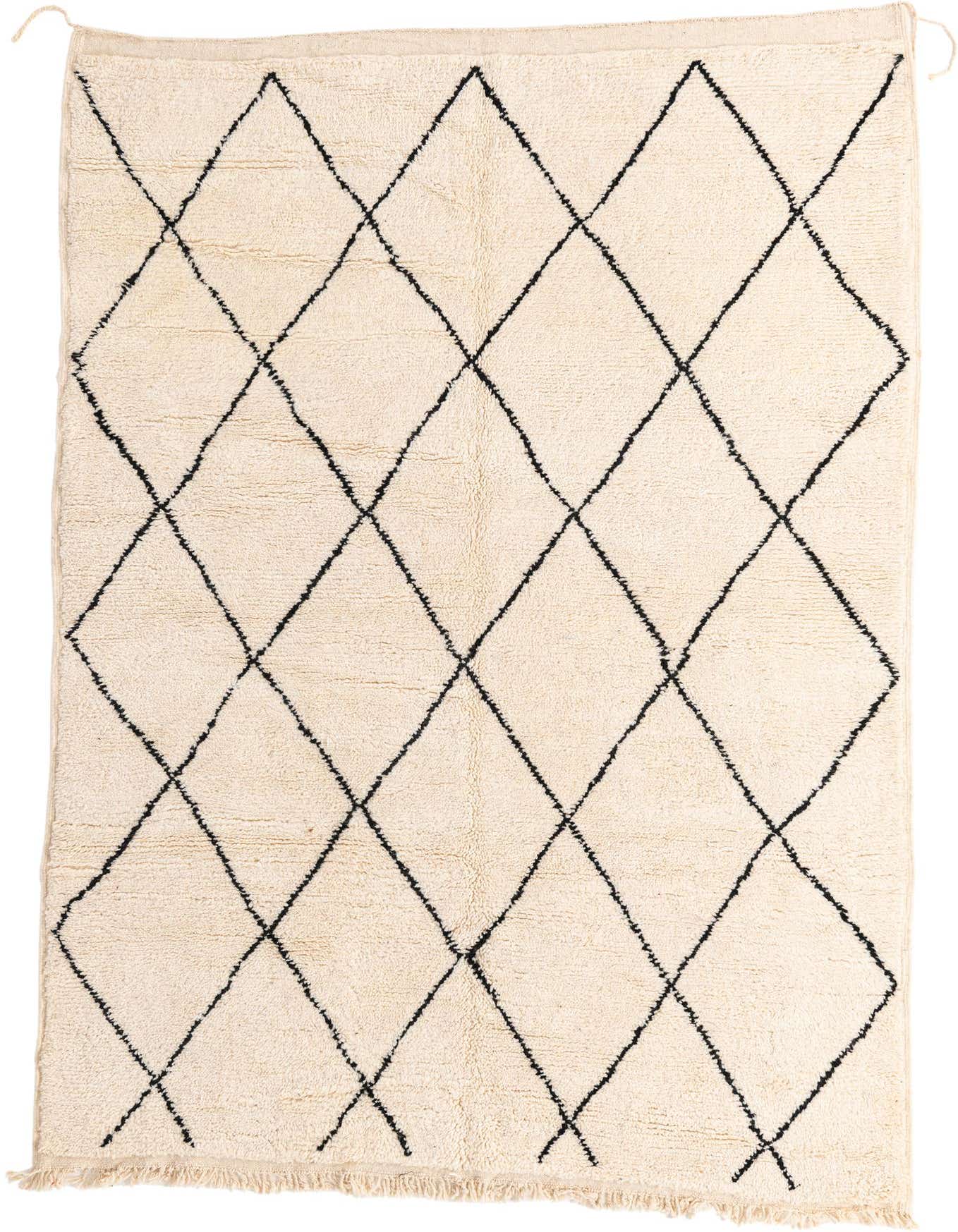 A 6x9 rectangular ivory shag rug with a black tribal diamond pattern, ideal for a living room.