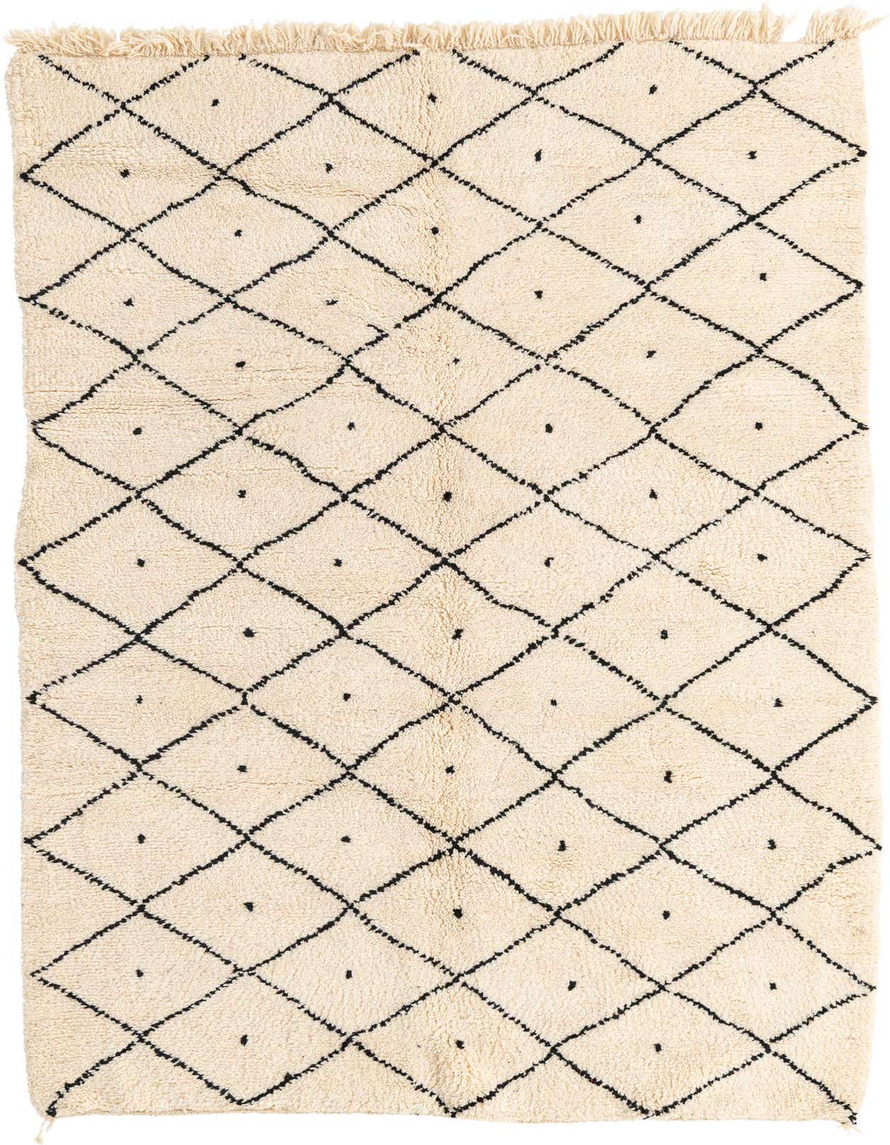 A rectangular 5x8 ivory shag rug with a black tribal diamond pattern and fringe, suitable for a living room.