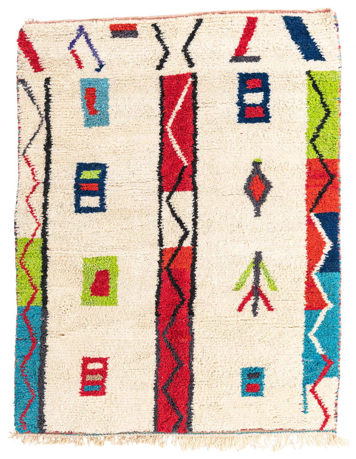 A 5x8 rectangular ivory shag rug with colorful tribal patterns in red, blue, green, and black.
