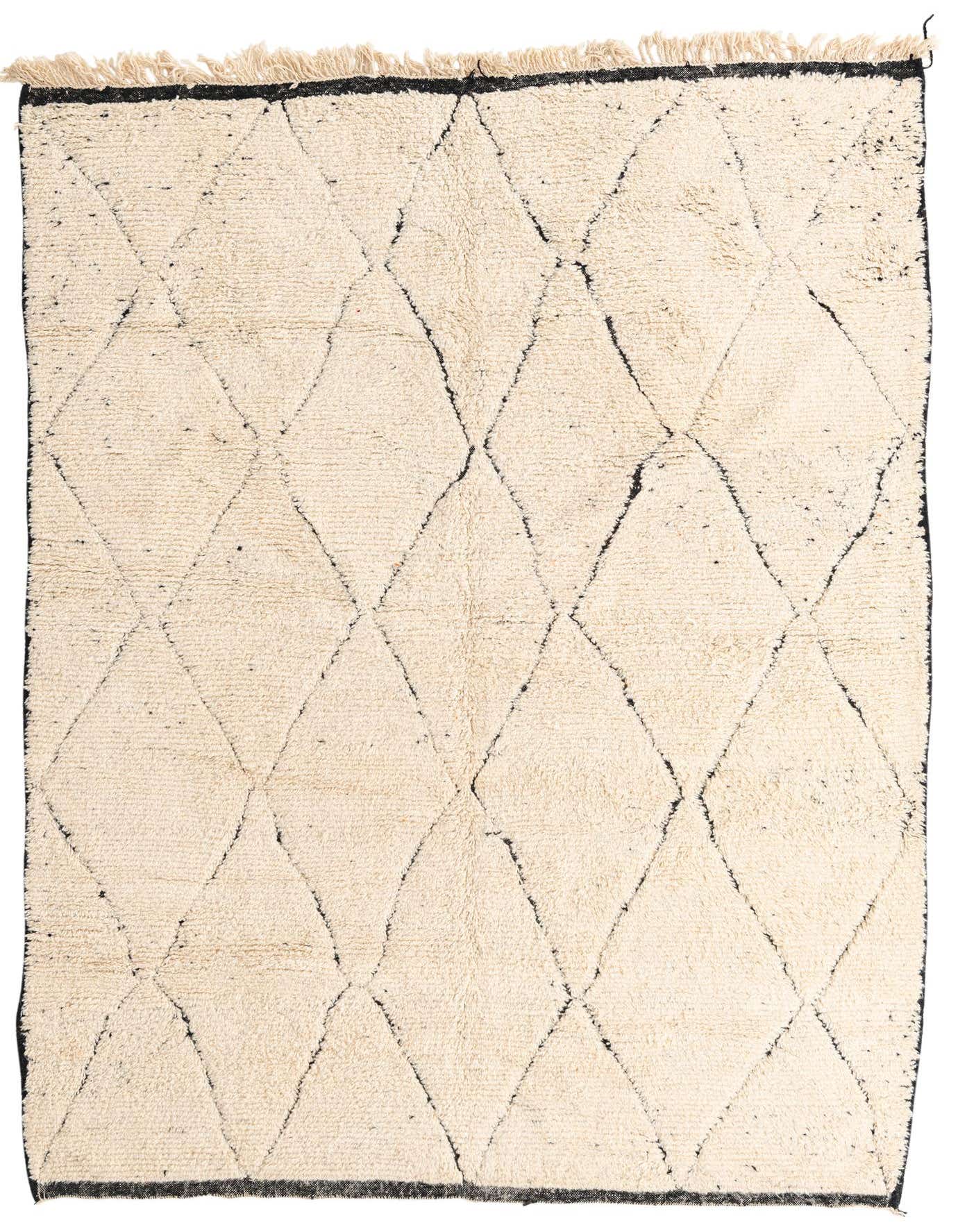 A 7x10 rectangular ivory shag rug with a black tribal diamond pattern and fringe, suitable for a living room.