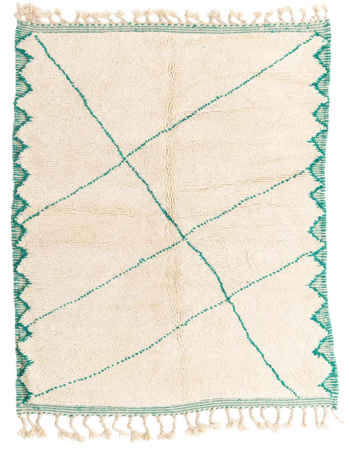 A 5x8 rectangular ivory shag rug with green tribal patterns and tassels, ideal for a living room.
