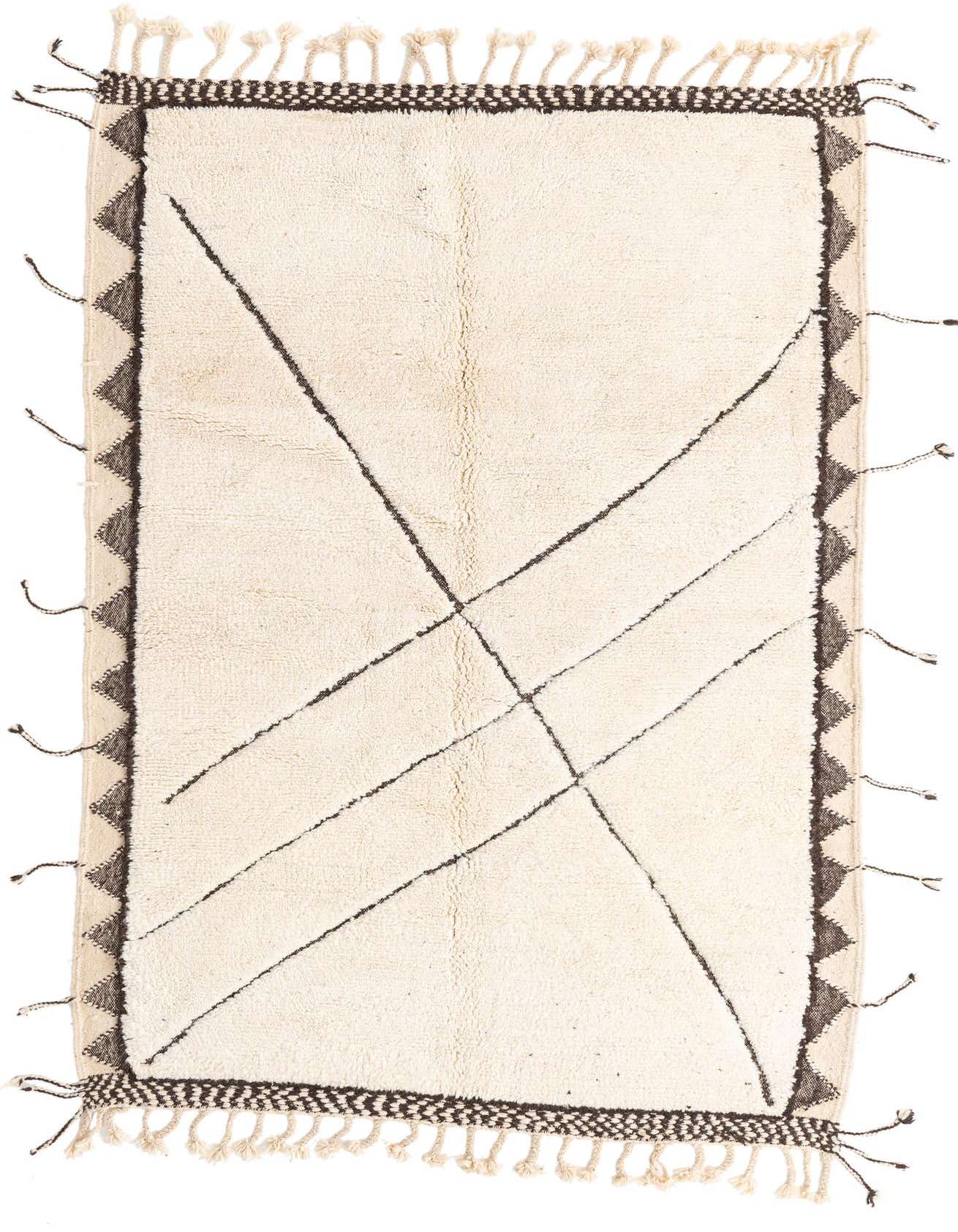 A 5x8 rectangular ivory shag rug with a tribal pattern, featuring dark abstract lines and a patterned border.