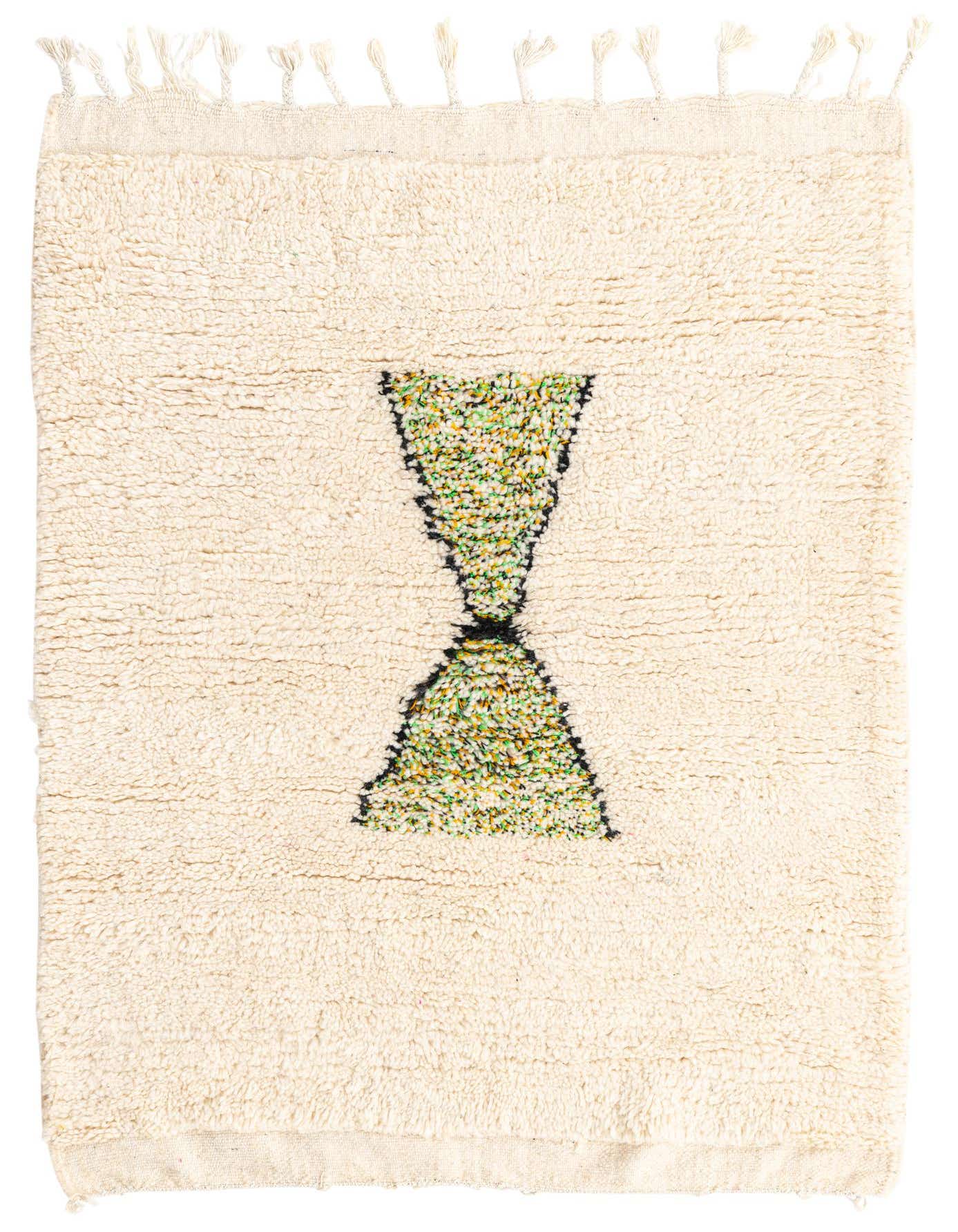 A 3x5 rectangular ivory shag rug with a central green and yellow hourglass-shaped tribal pattern, featuring tassels.